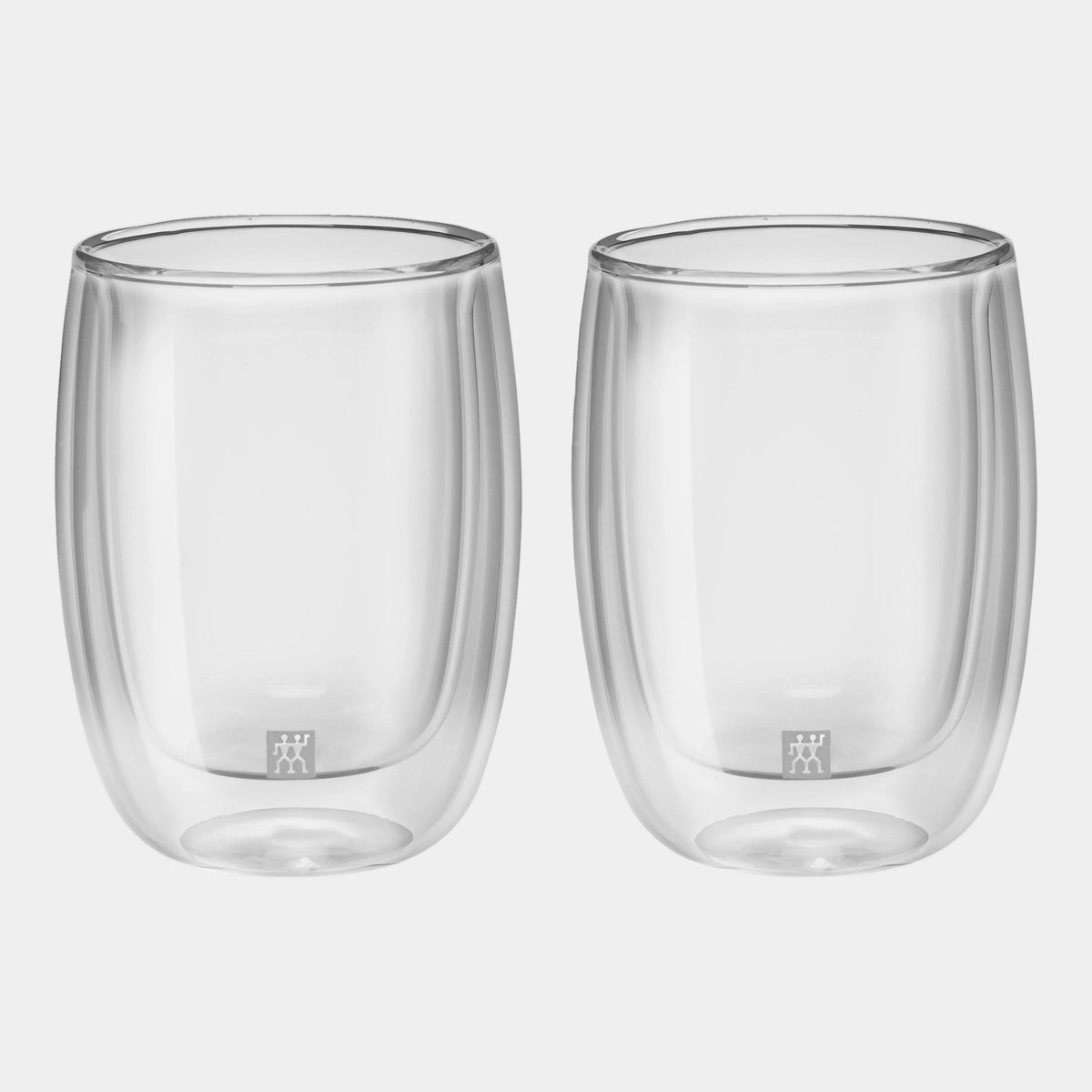 Two clear glass tumblers with a brand logo on a white background