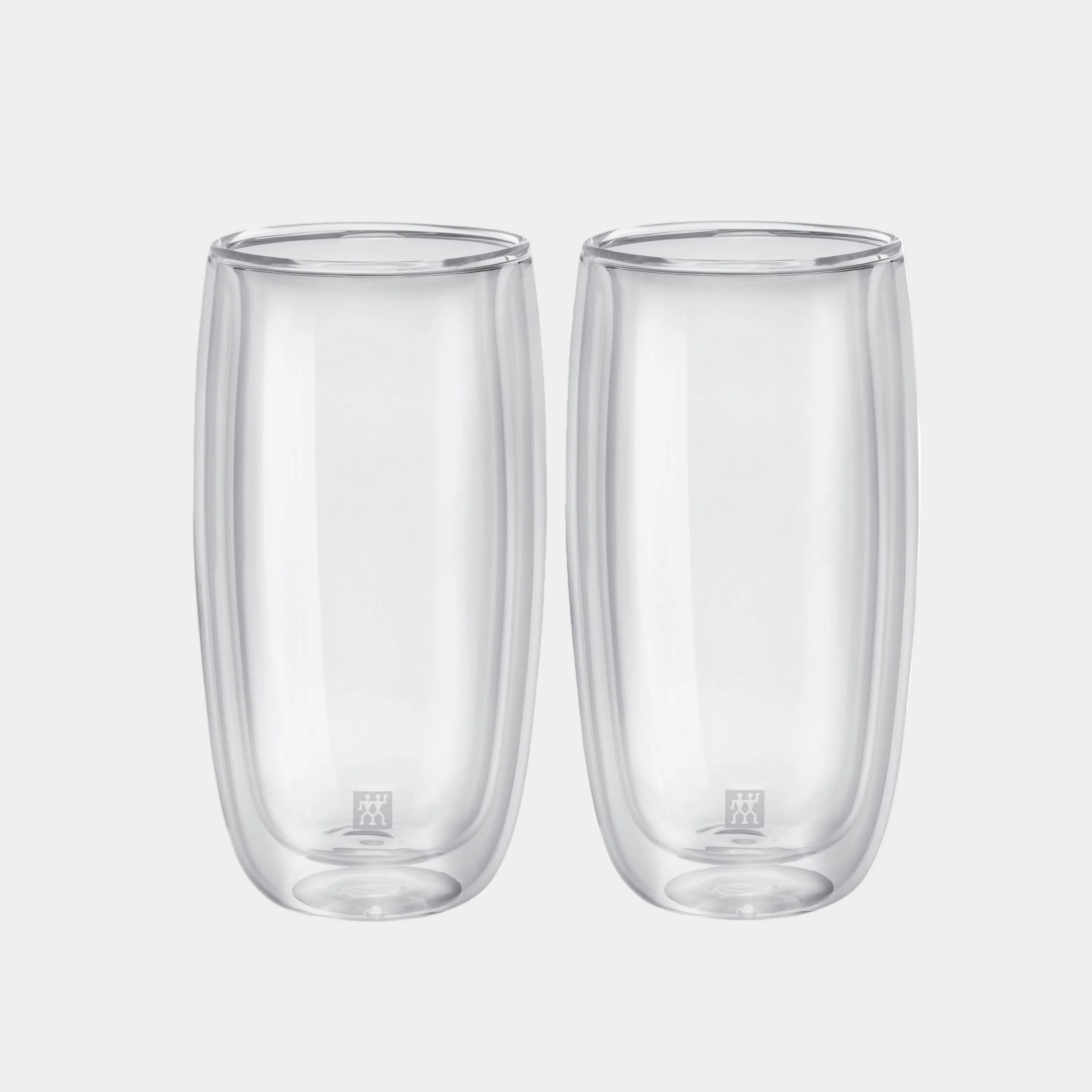 Two clear glass tumblers on a white background