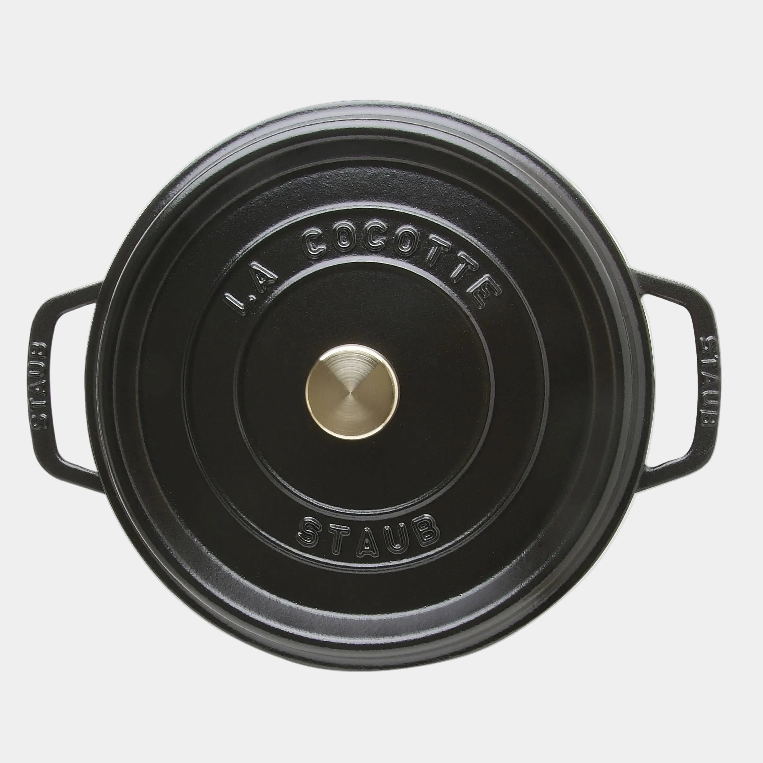 Black Staub cocotte pot on a white background