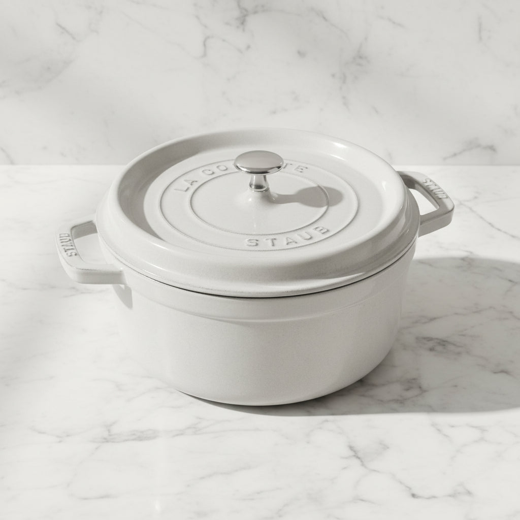 White Staub cocotte on a marble surface