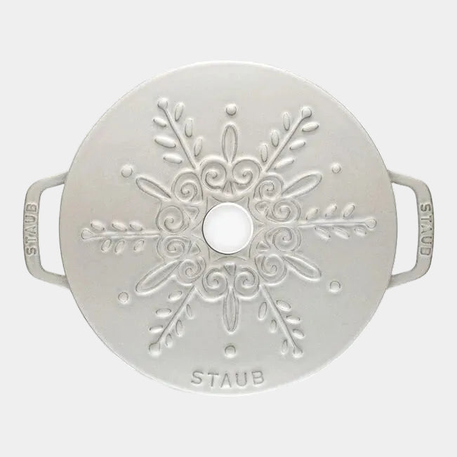 Top view of STAUB La Cocotte 3.6L Round French Oven in Snowflake White Truffle with decorative lid design