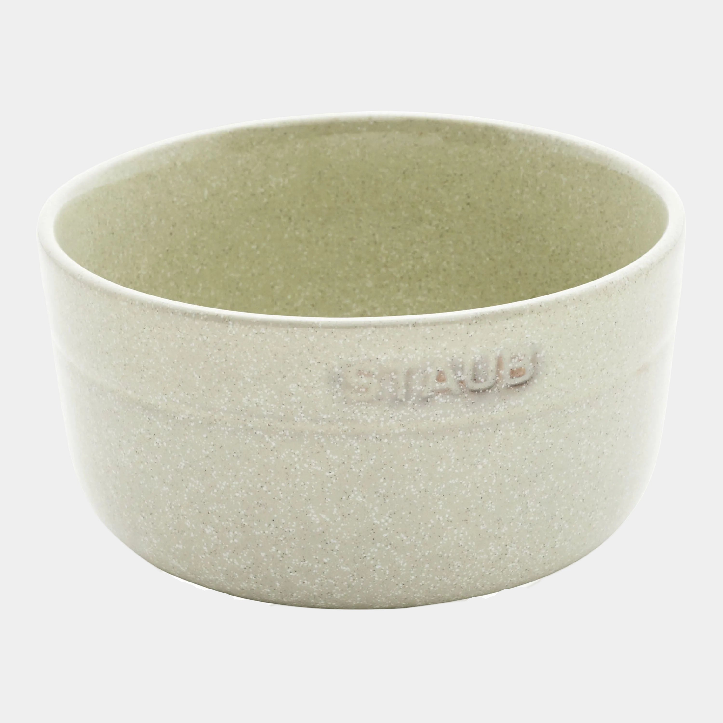 Light green ceramic bowl with 'Ceramica' branding on a white background
