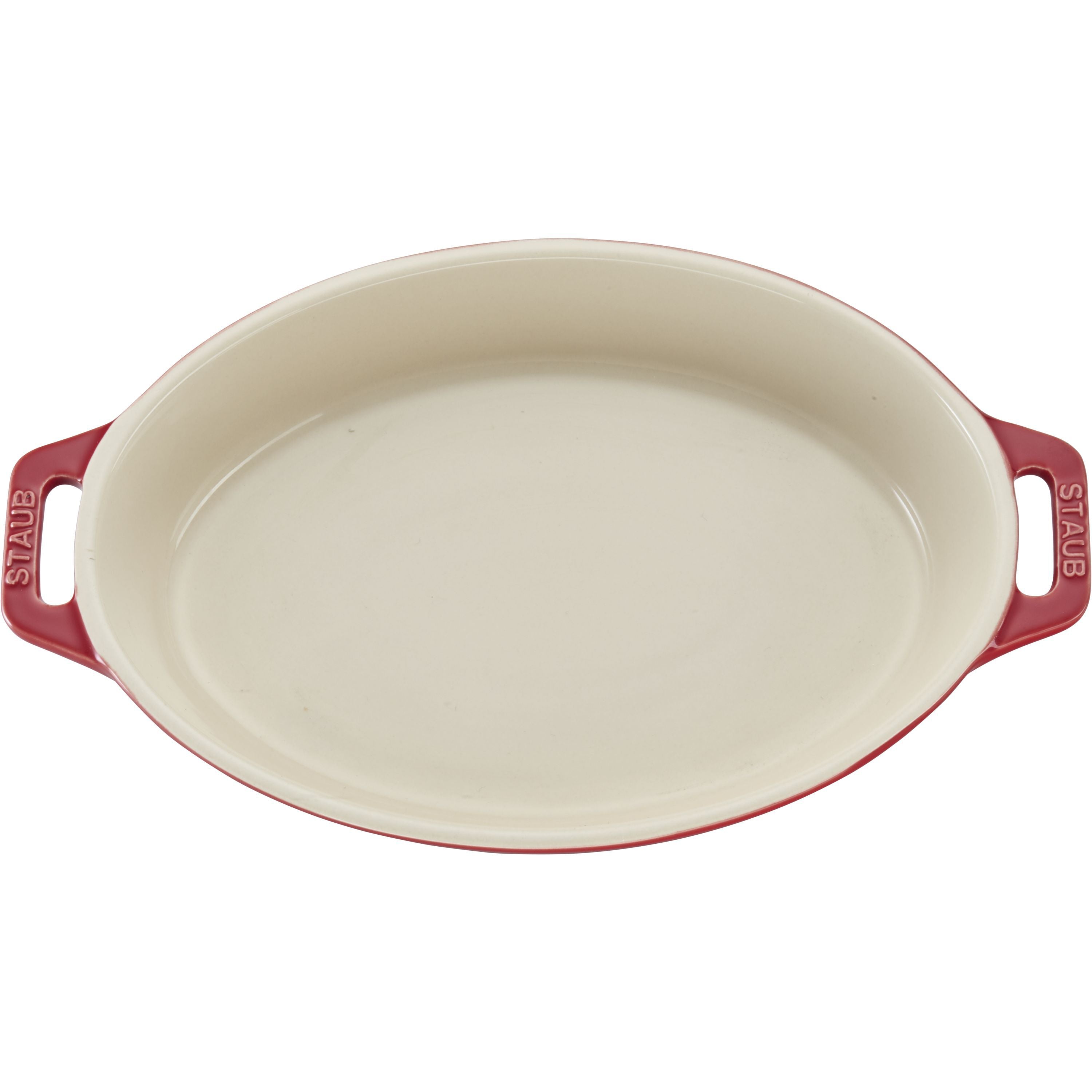 Red STAUB Ceramique Ceramic Oval Oven Dish with handles on a white background