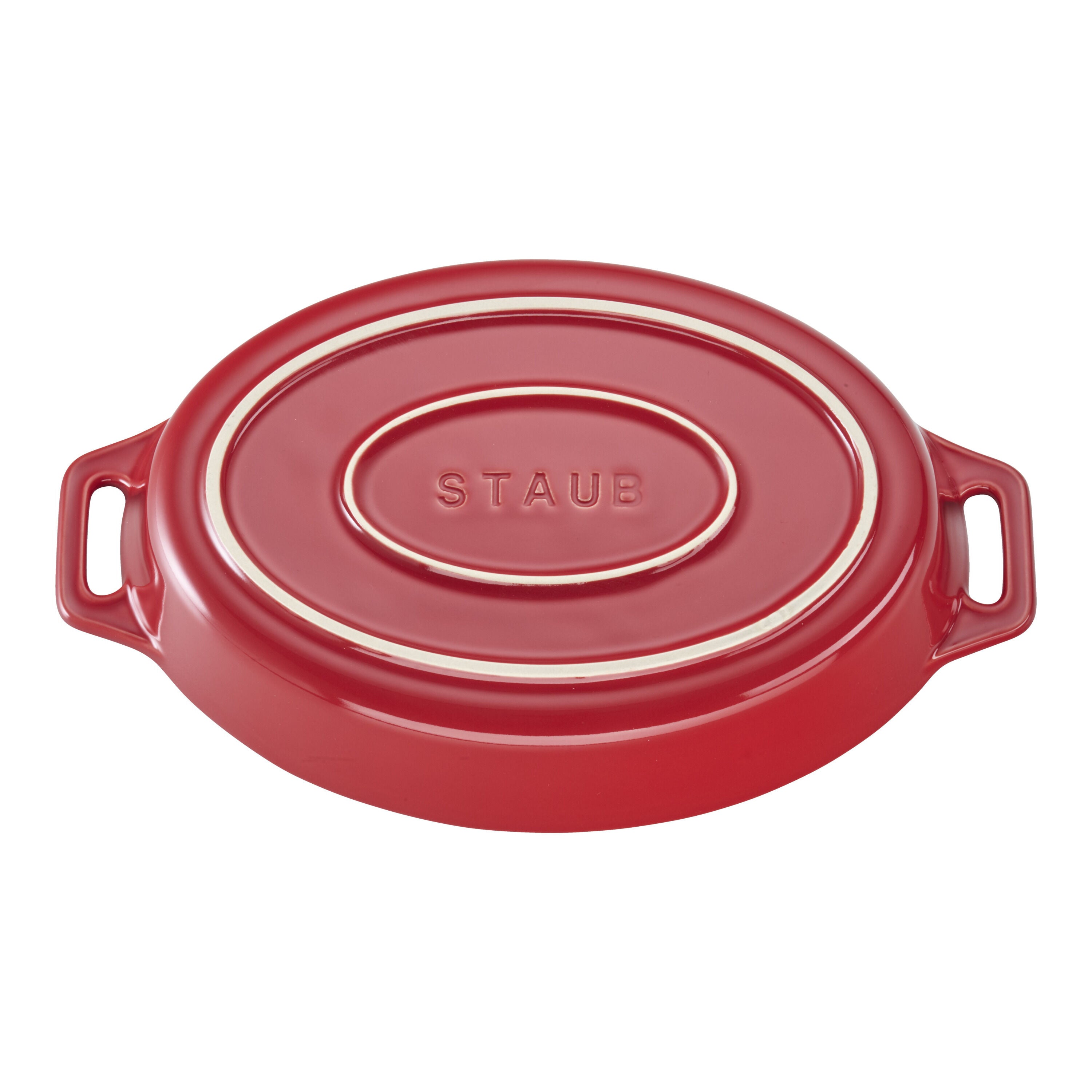 Red STAUB Ceramique Ceramic Oval Oven Dish flipped on a white background