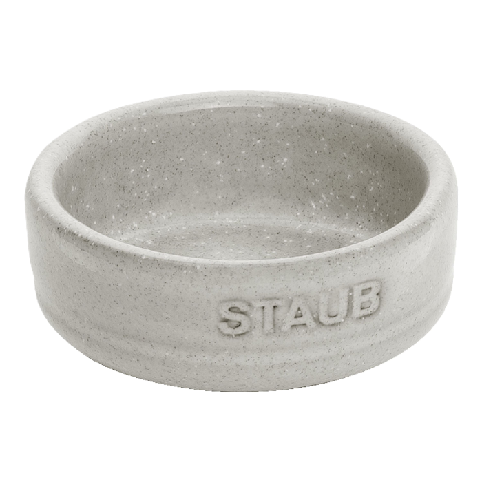 Gray ceramic bowl with 'Staub' branding on a white background