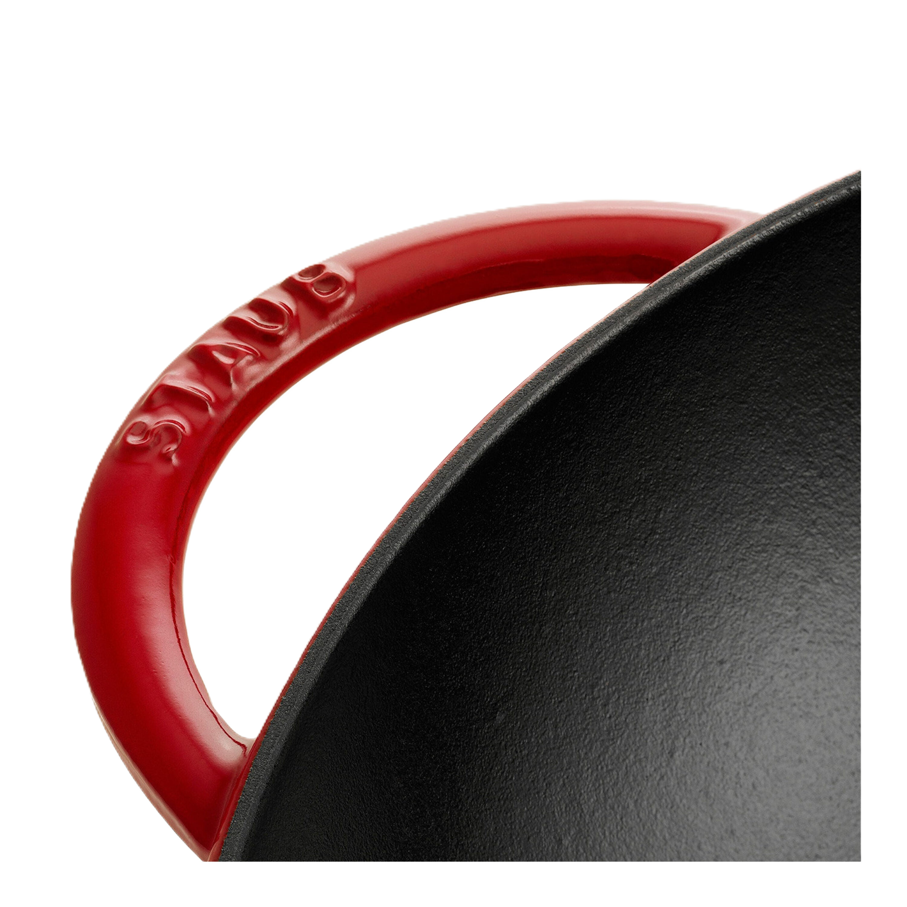 Close-up of a red-handled frying pan with 'Le Creuset' branding on a white background.