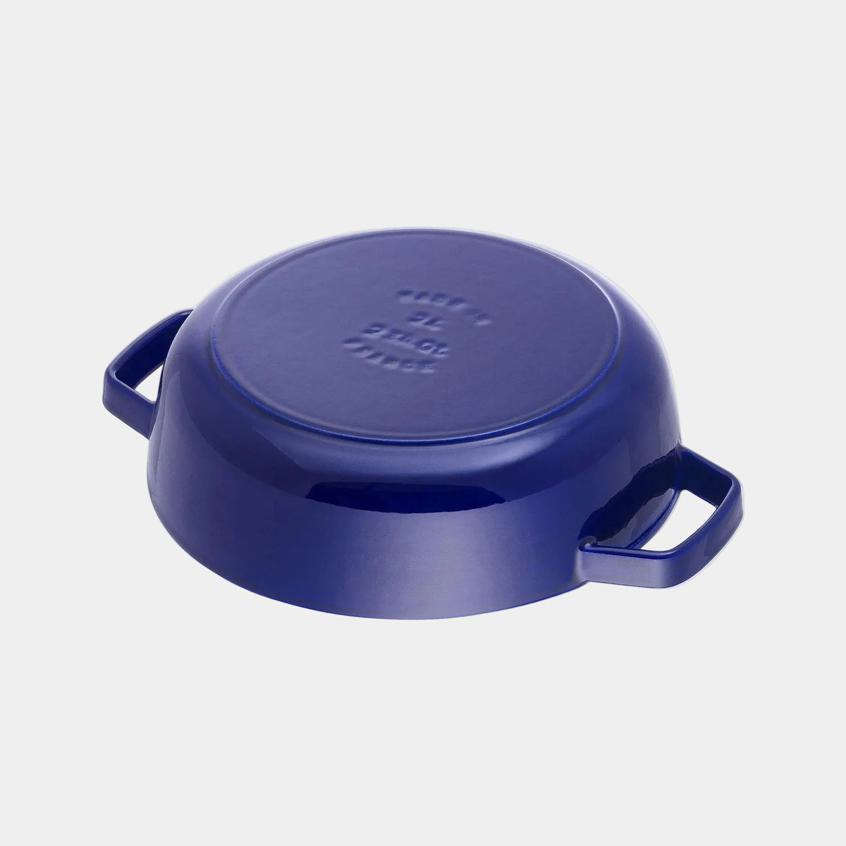 Blue cast iron skillet with lid on a white background
