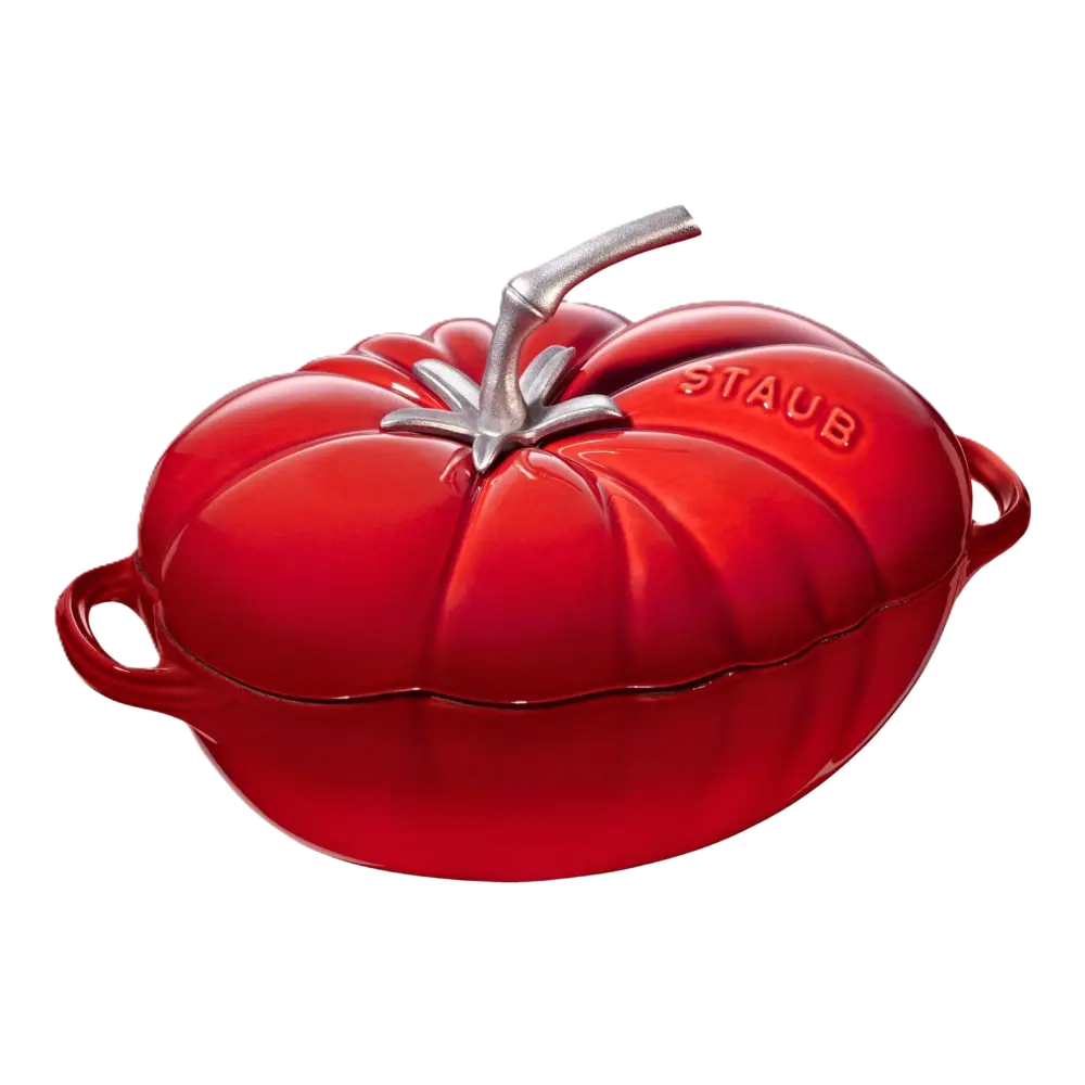 Red Staub tomato-shaped cocotte on a white background