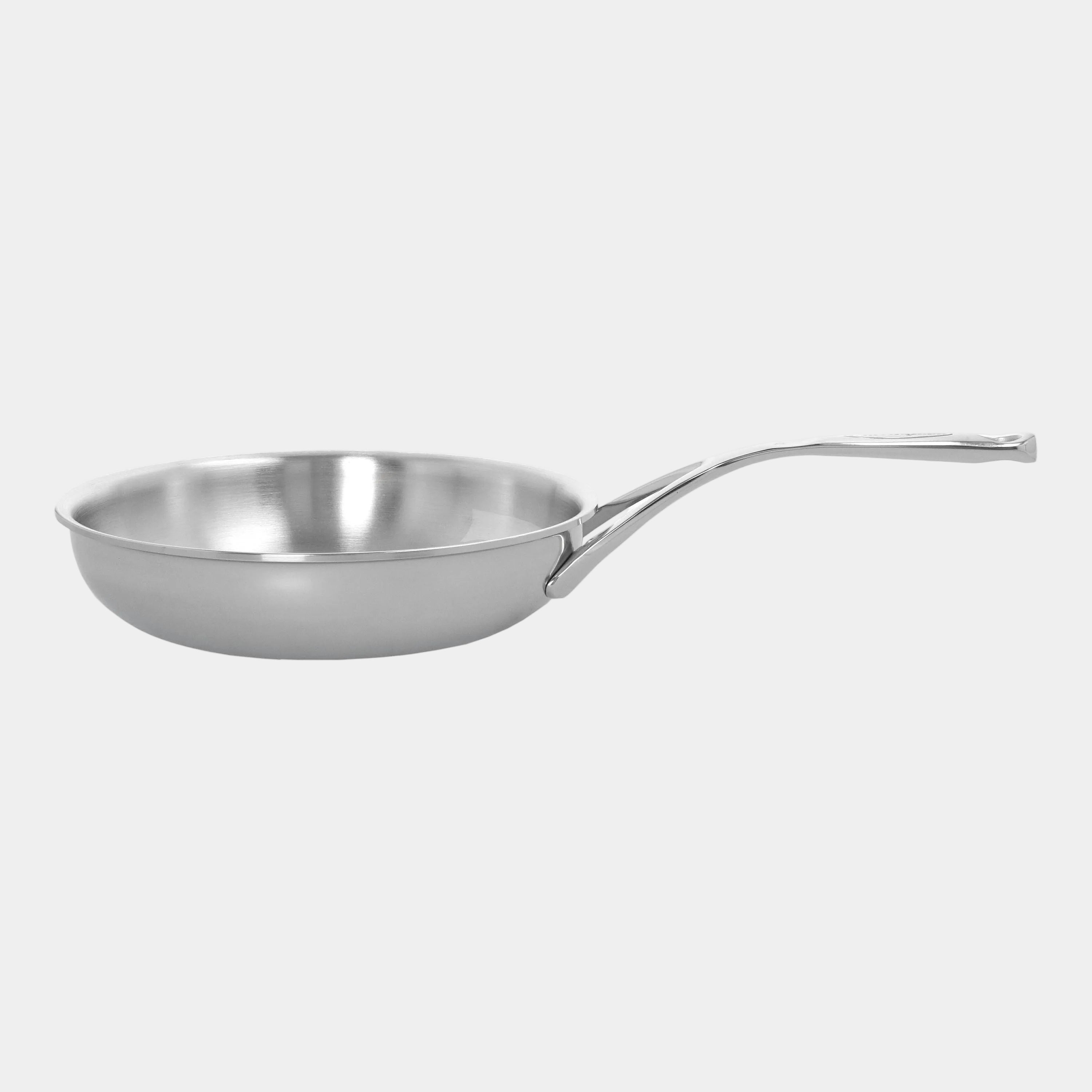 Stainless steel frying pan on a white background