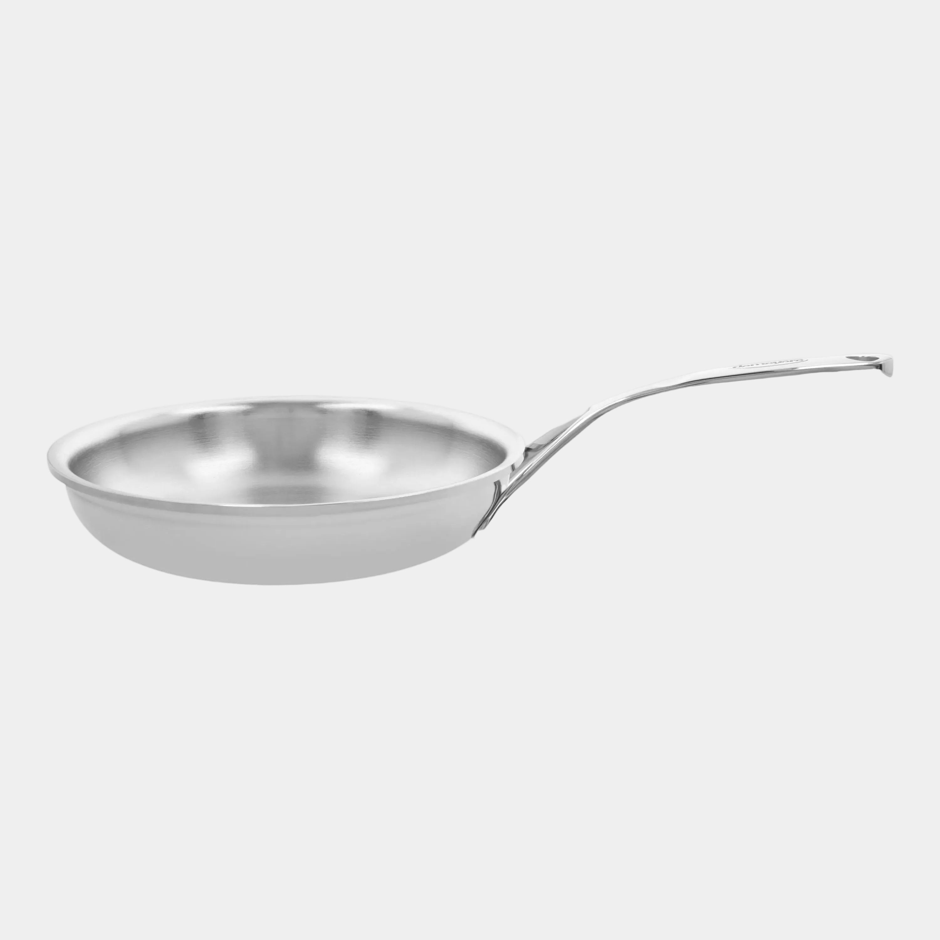 Stainless steel frying pan on a white background