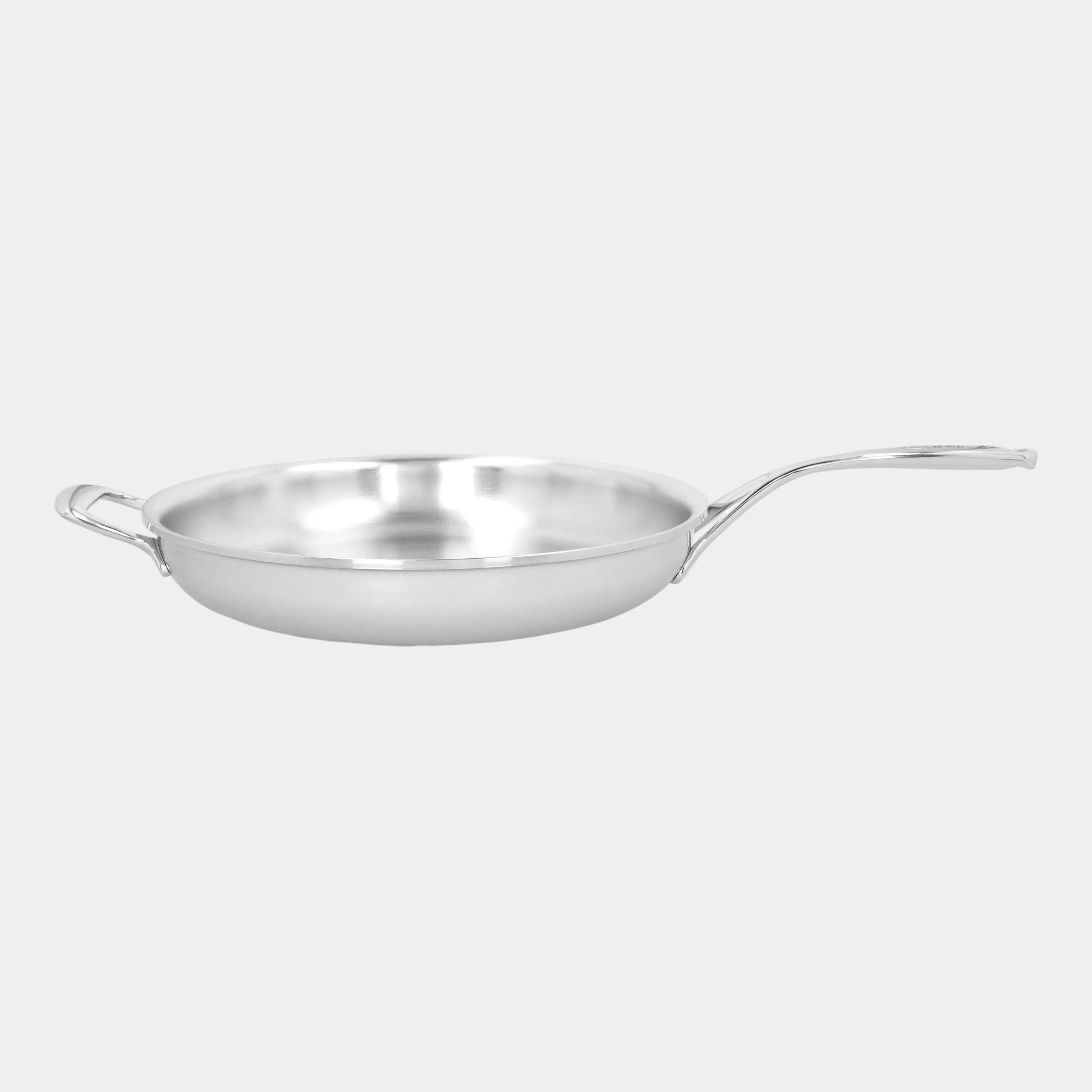 Stainless steel frying pan on a white background