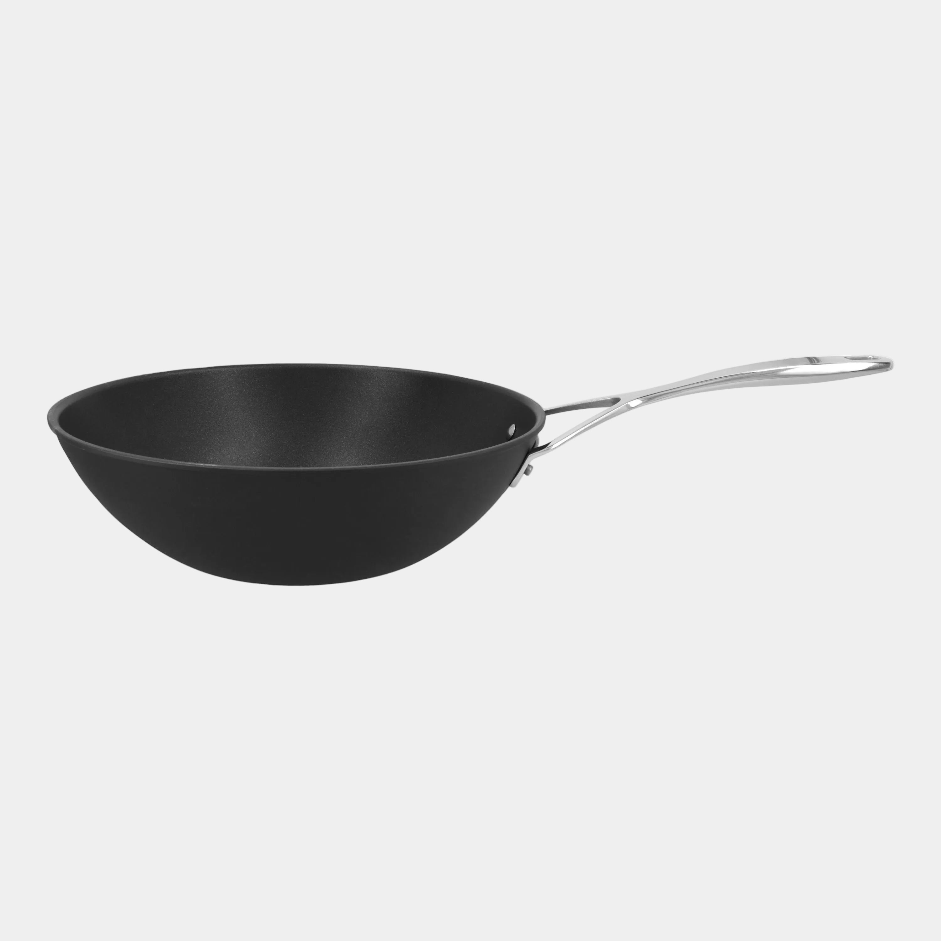 Black wok with a silver handle on a white background
