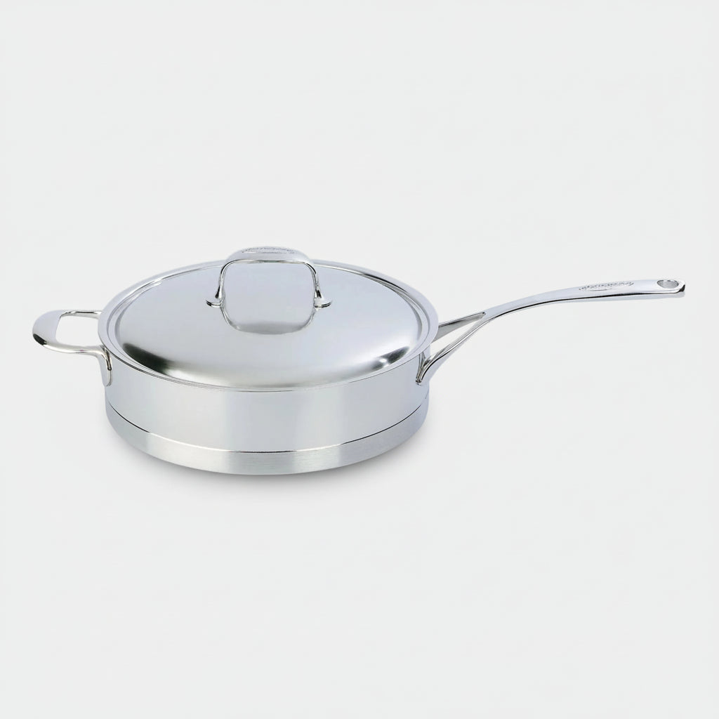 Stainless steel sauté pan with lid on a white background
