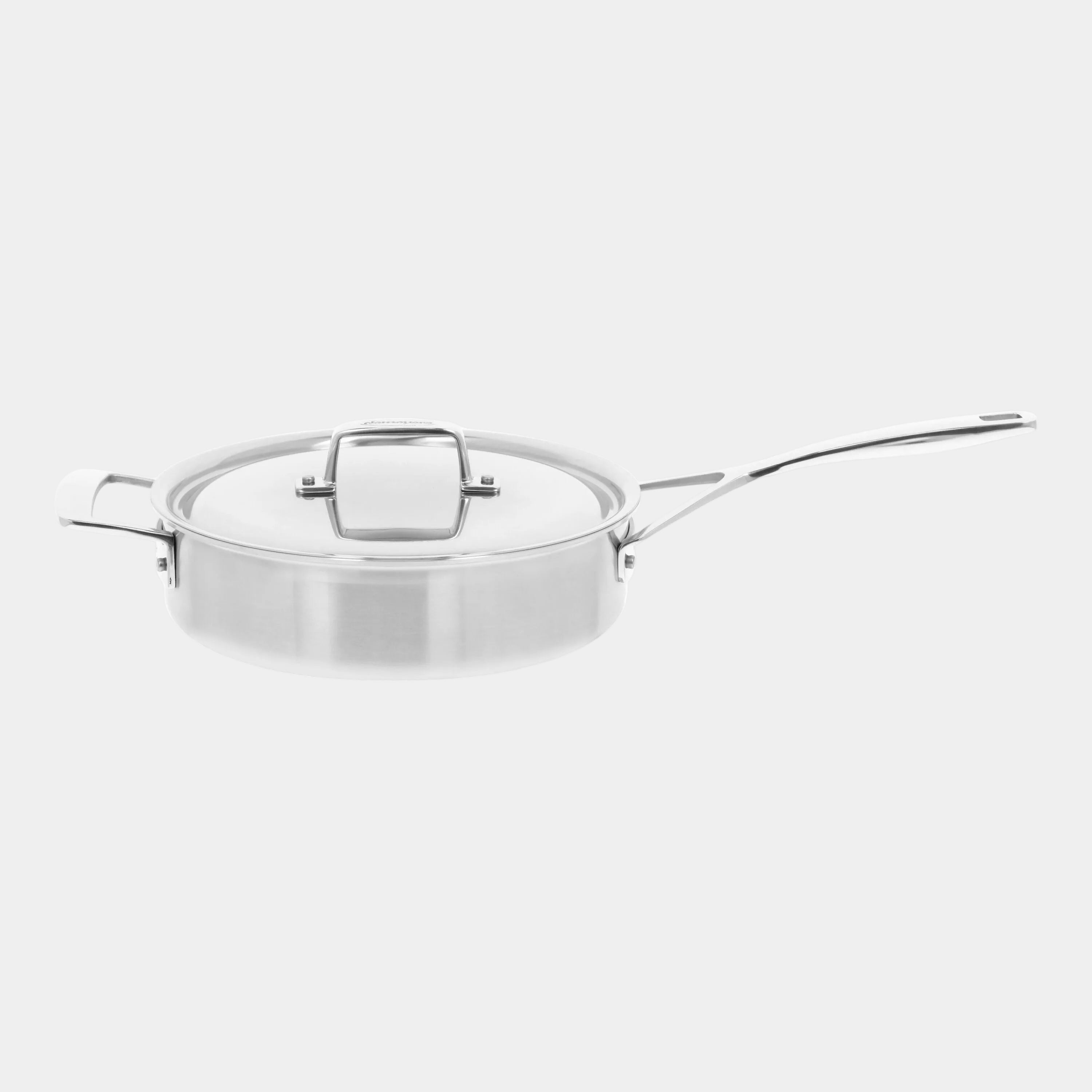 Stainless steel sauté pan with lid on a white background