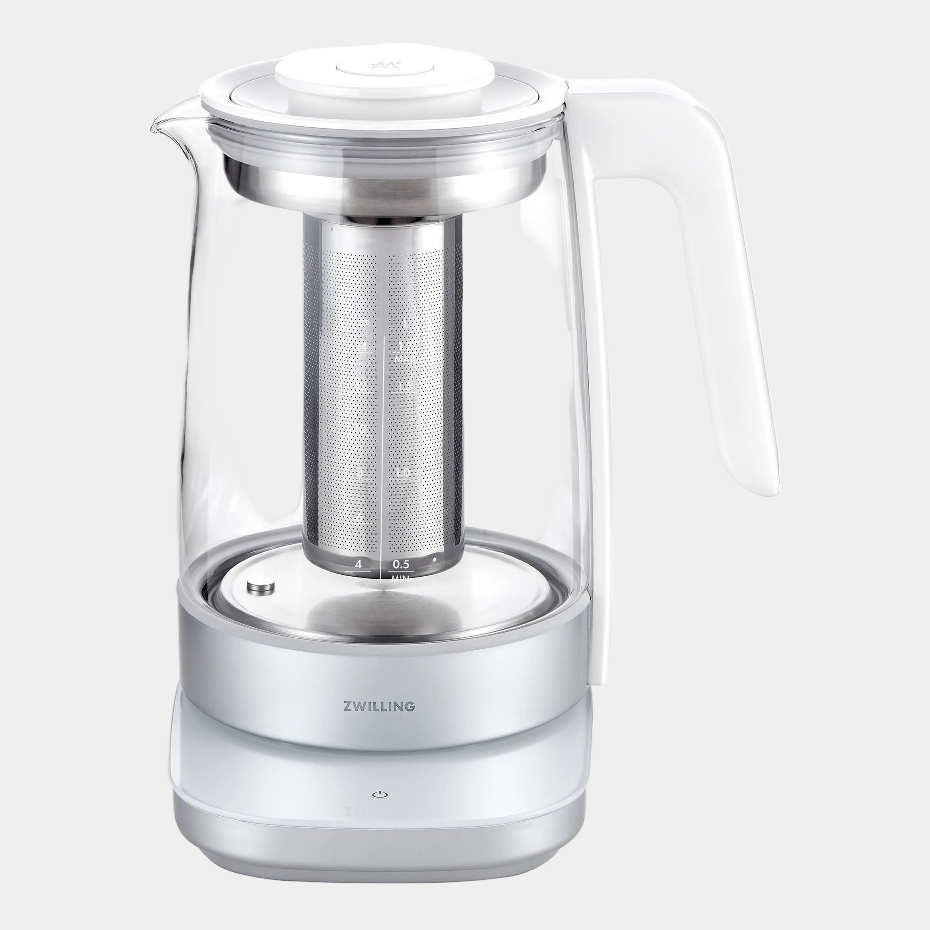 Clear glass teapot with silver interior and handle on a white background