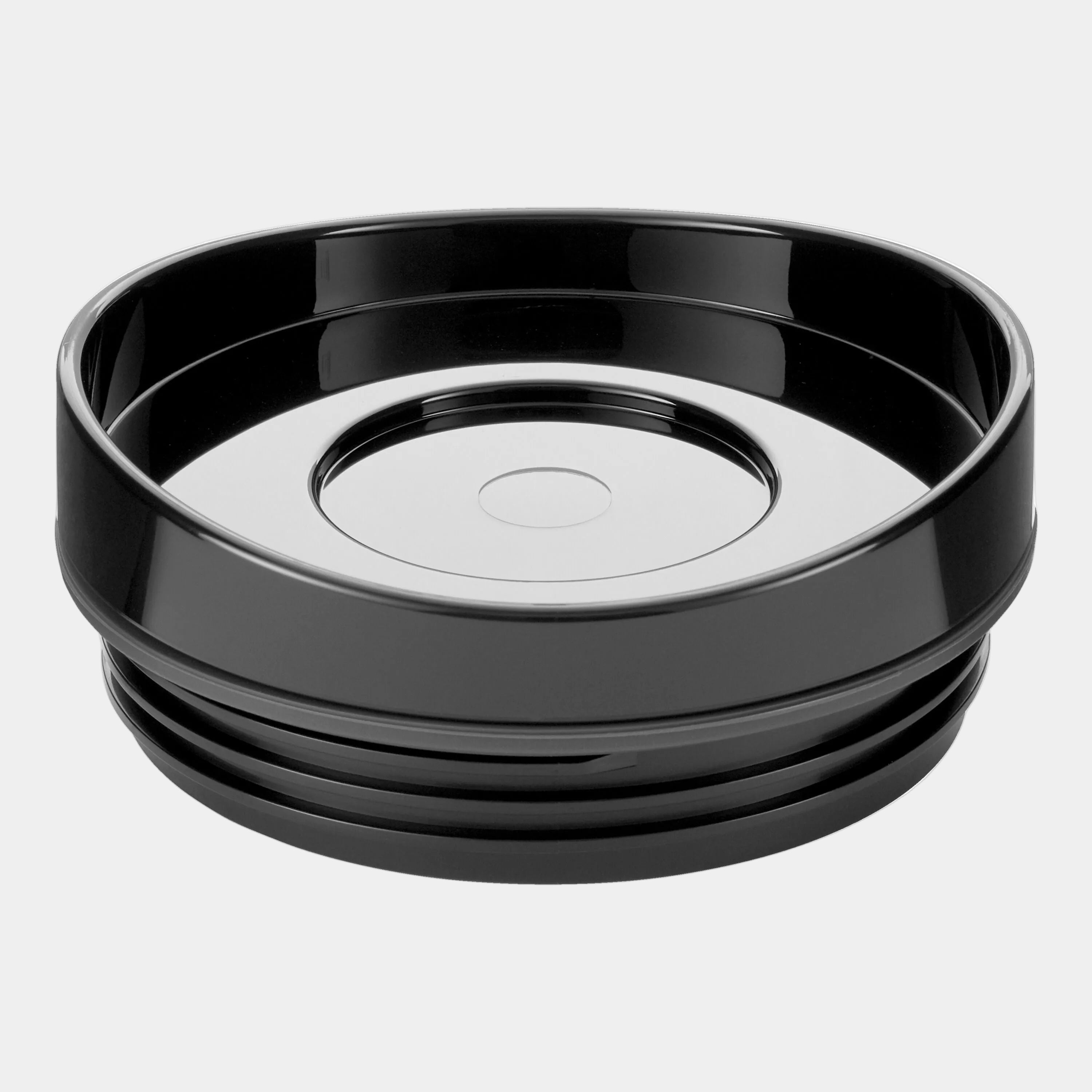 Black plastic bowl with a white interior on a white background