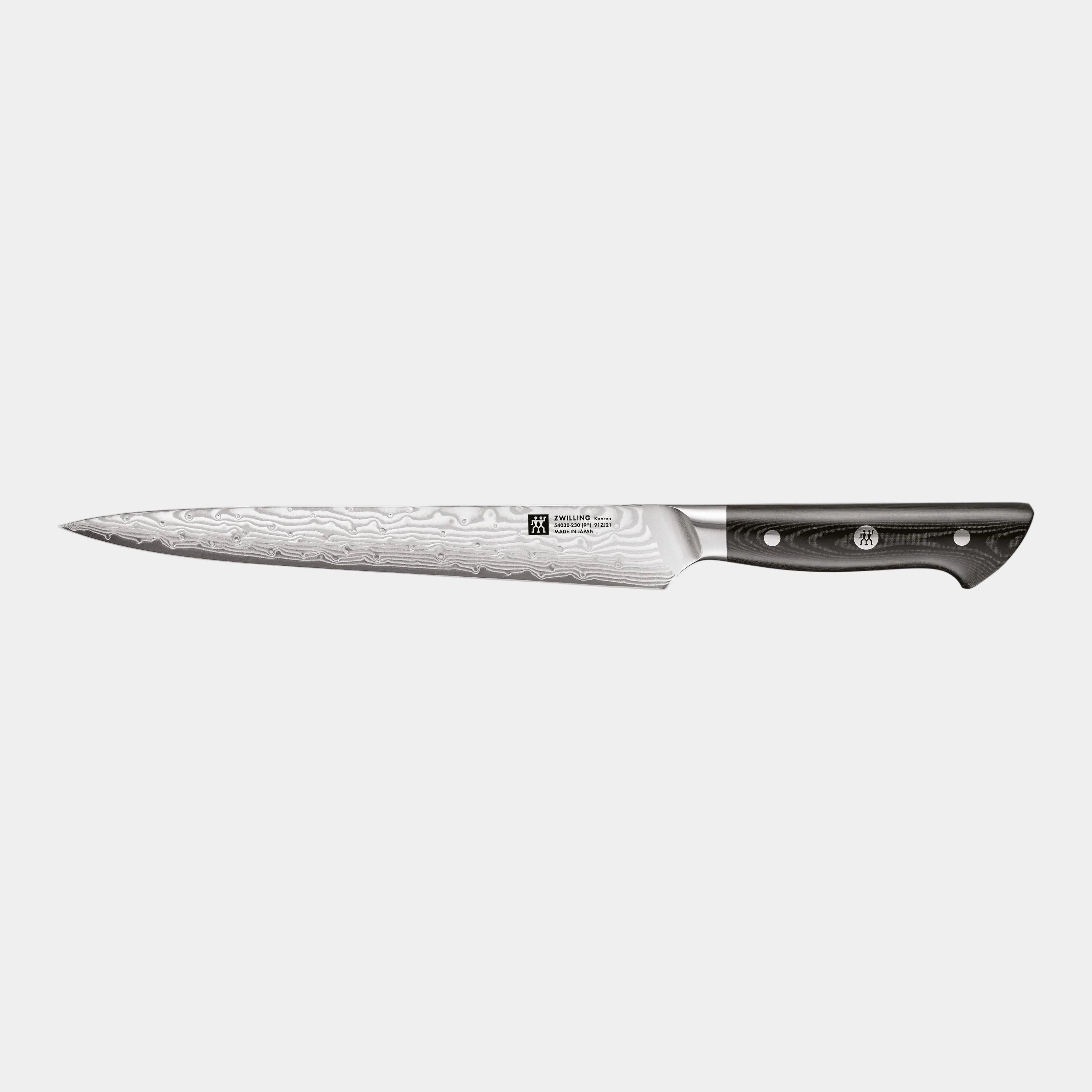 Forked knife with a black handle on a white background