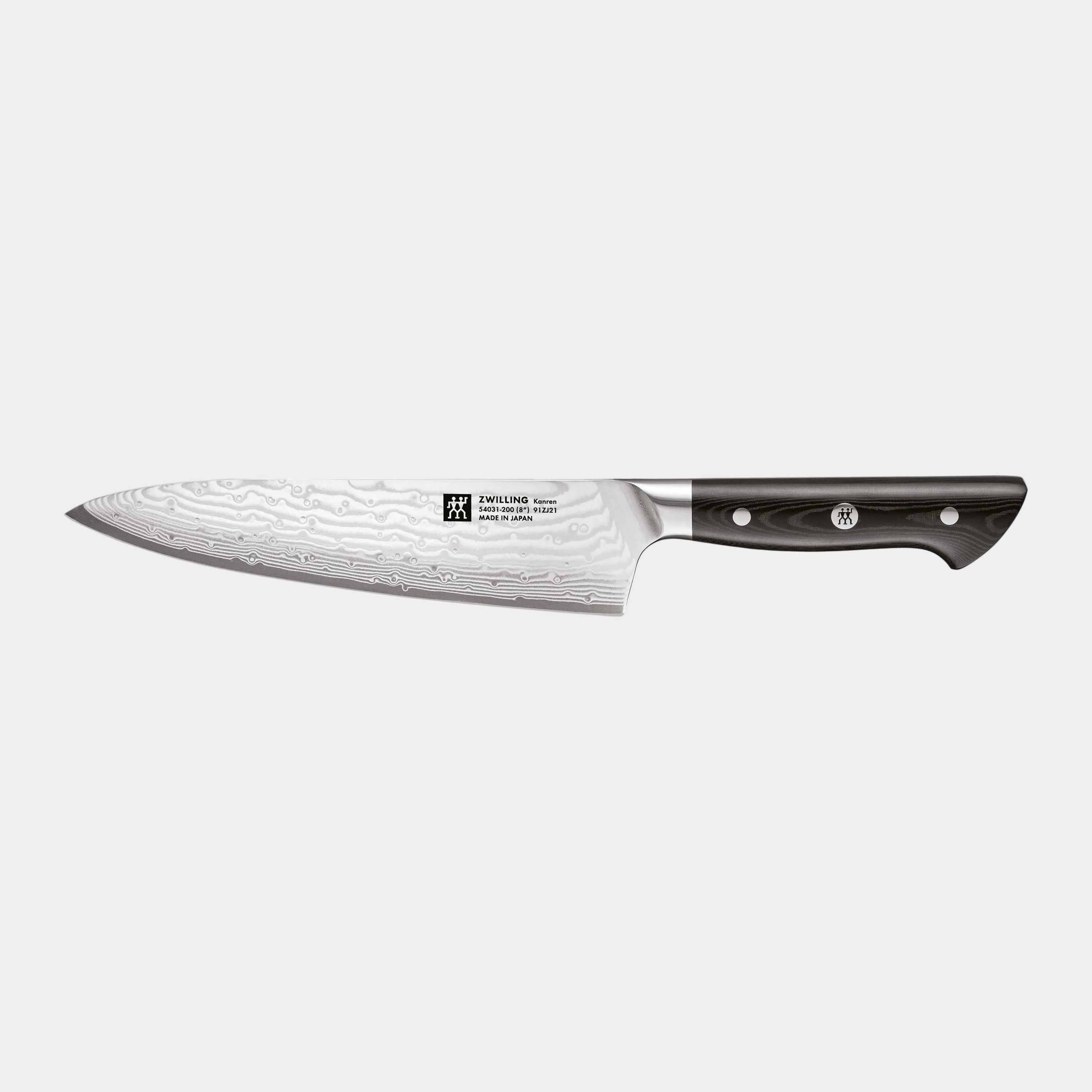 Chef's knife with a black handle on a white background