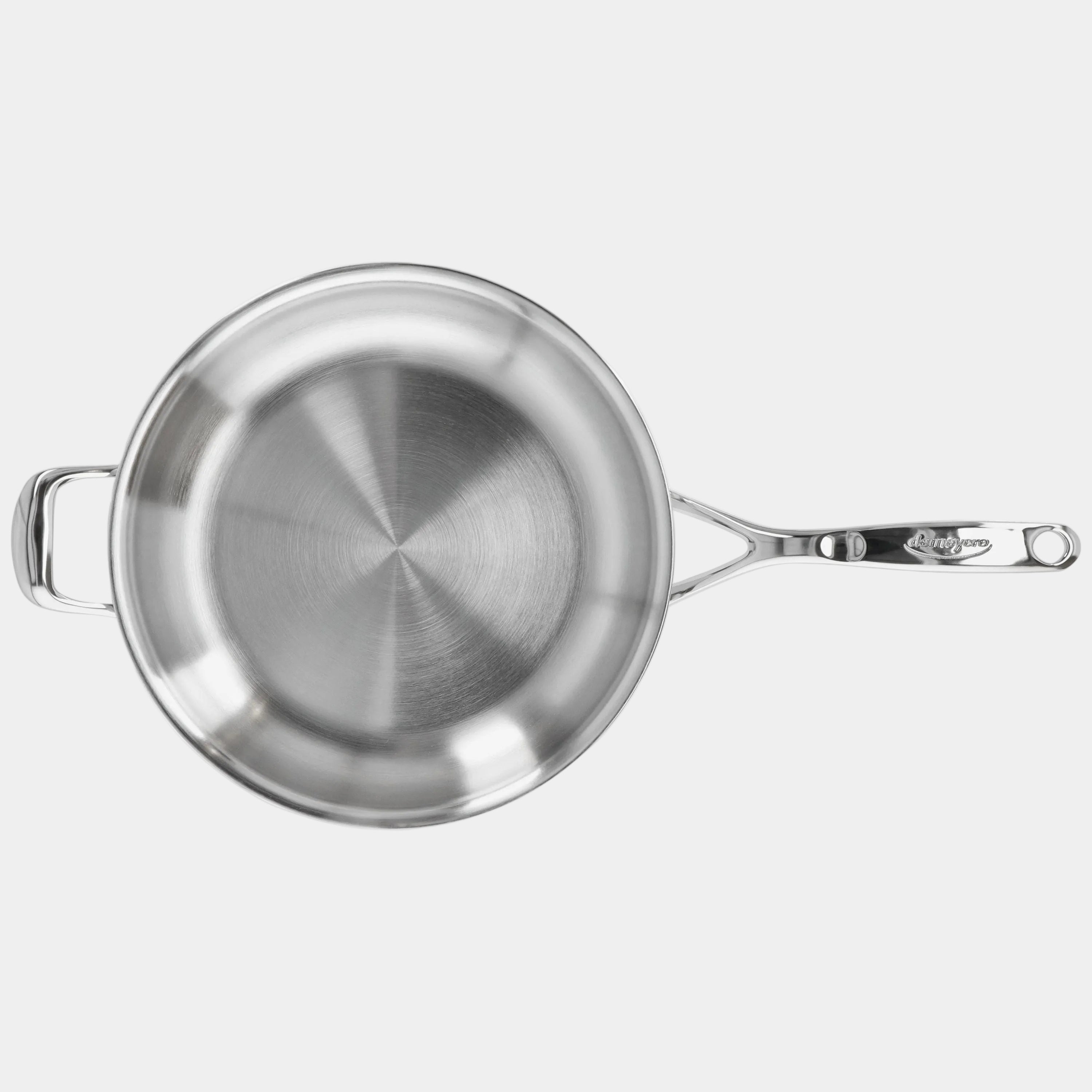 Stainless steel frying pan on a white background