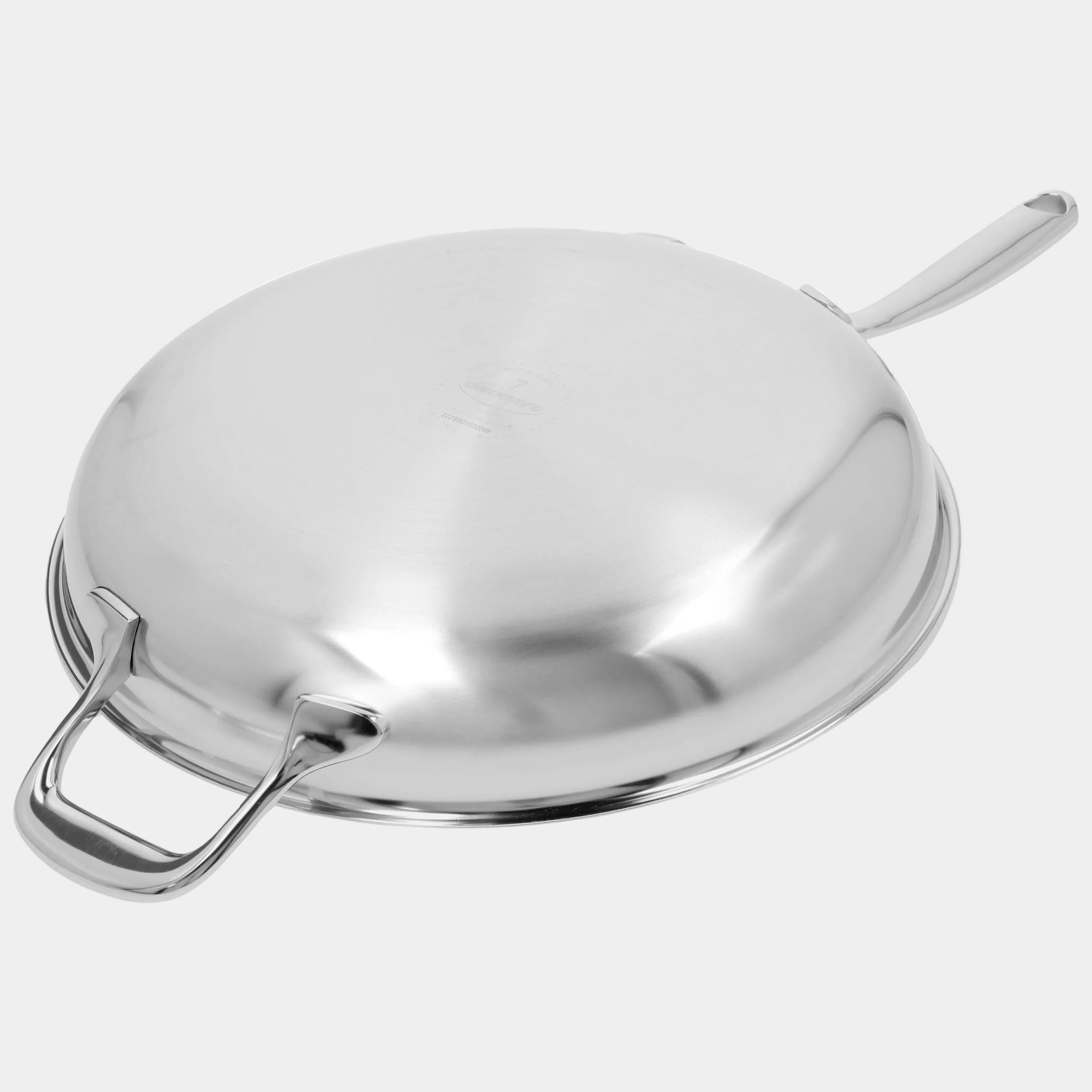 Stainless steel wok with lid on a white background