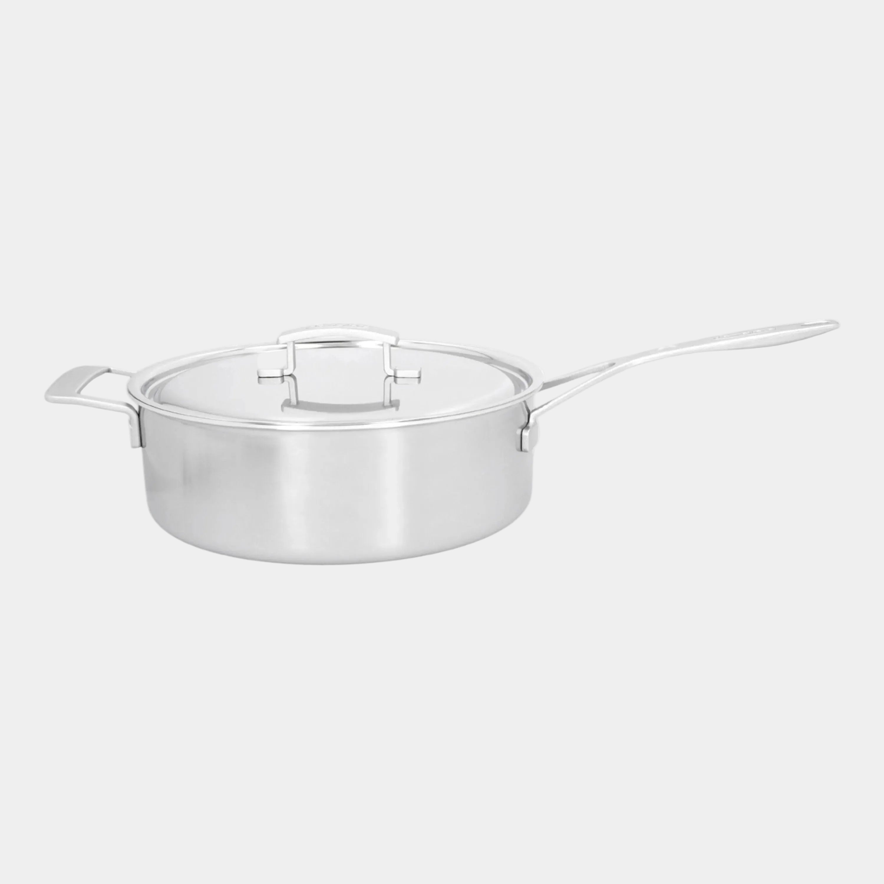 Stainless steel pot with lid on a white background