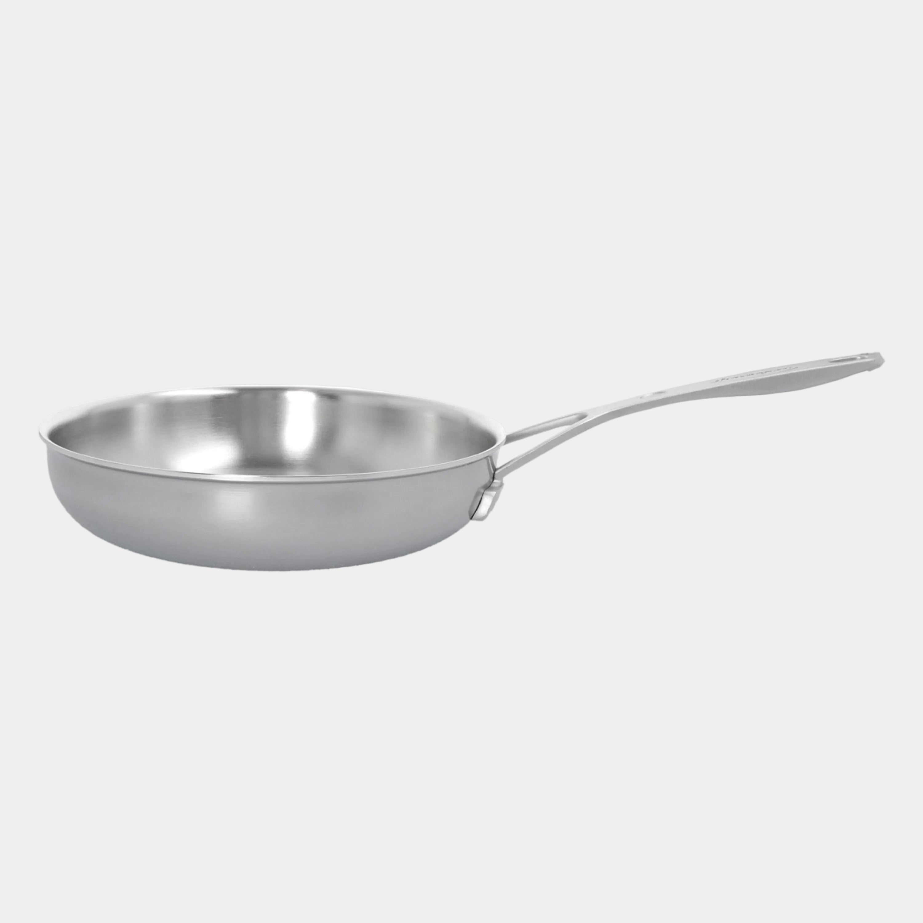 Stainless steel frying pan on a white background