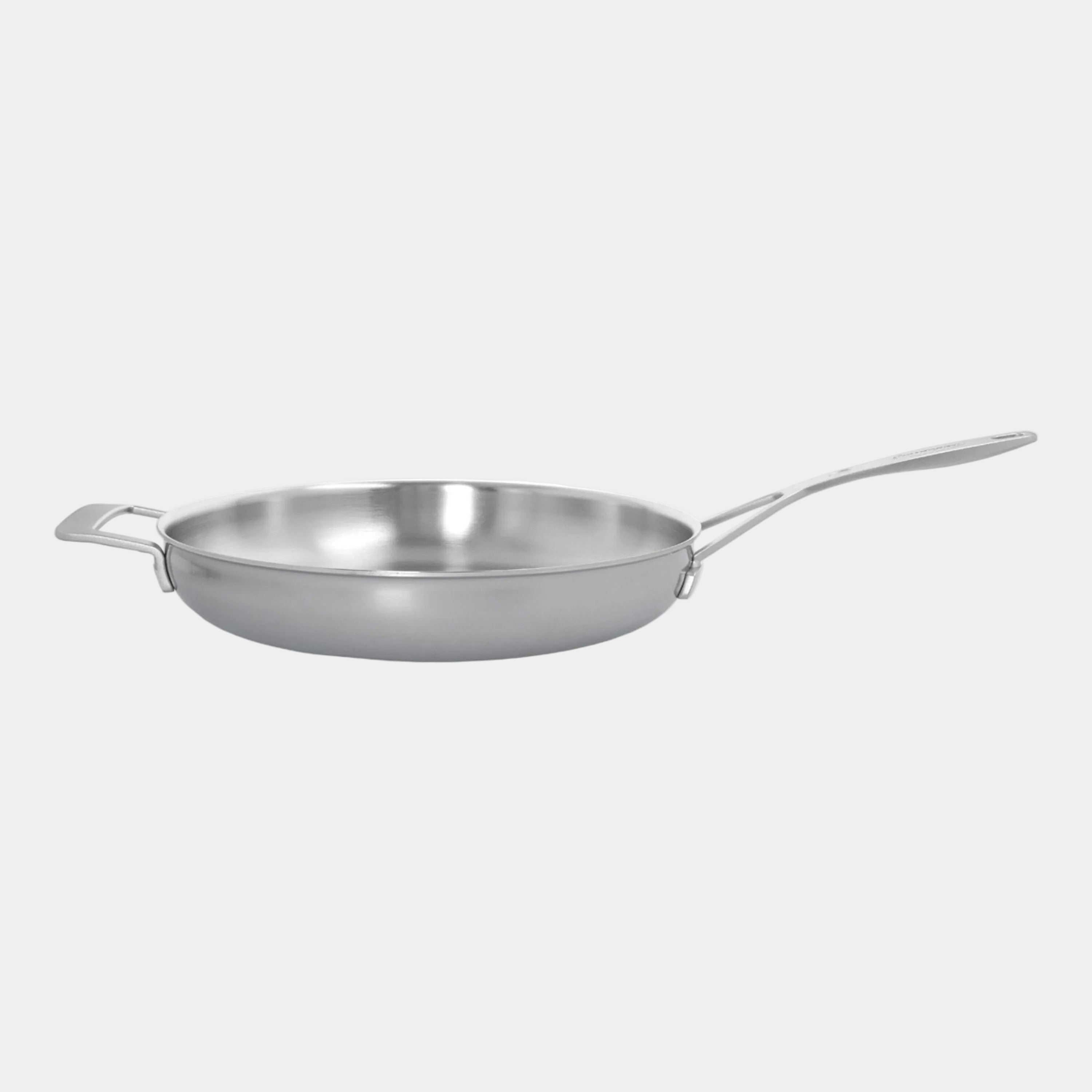 Stainless steel frying pan on a white background