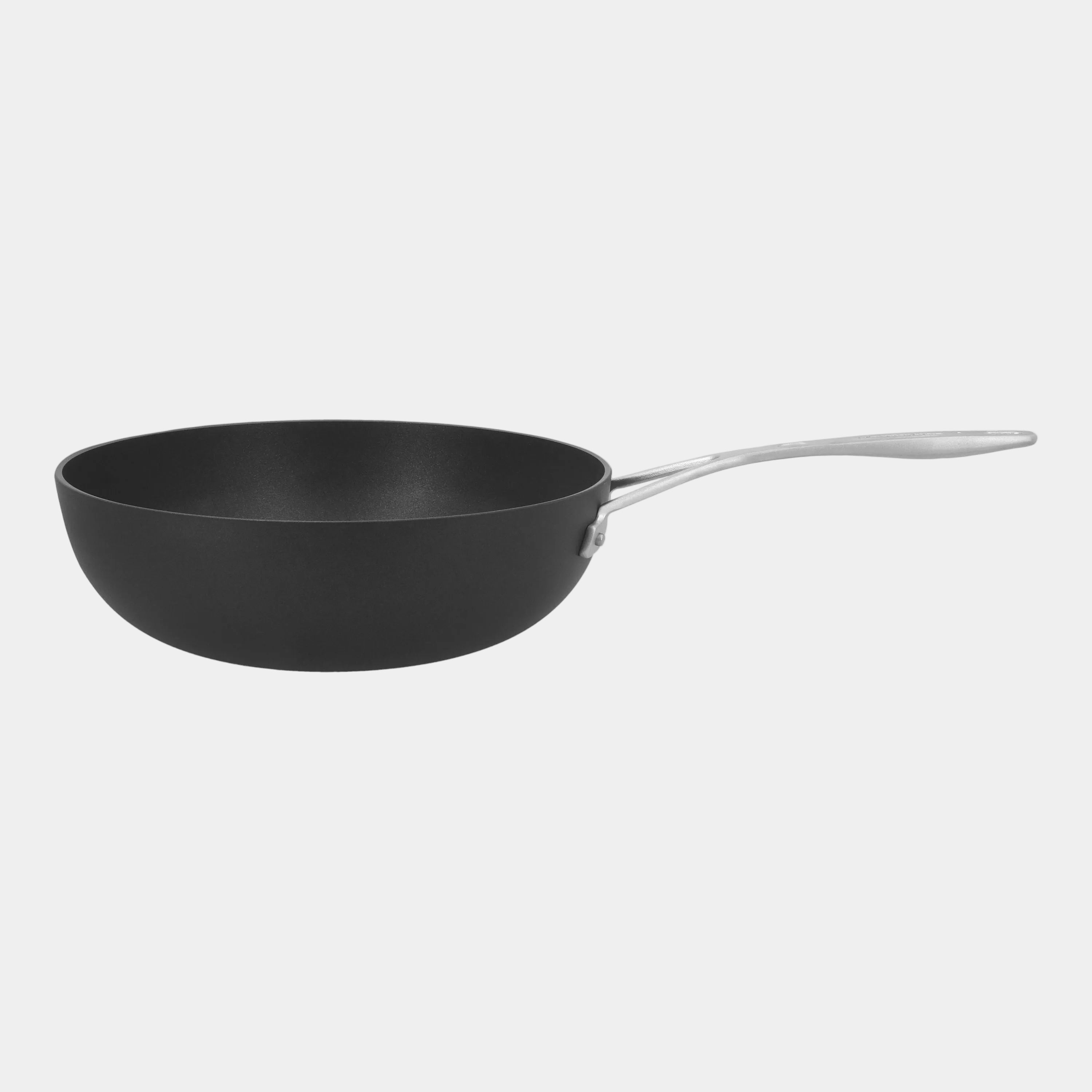 Black frying pan with a silver handle on a white background