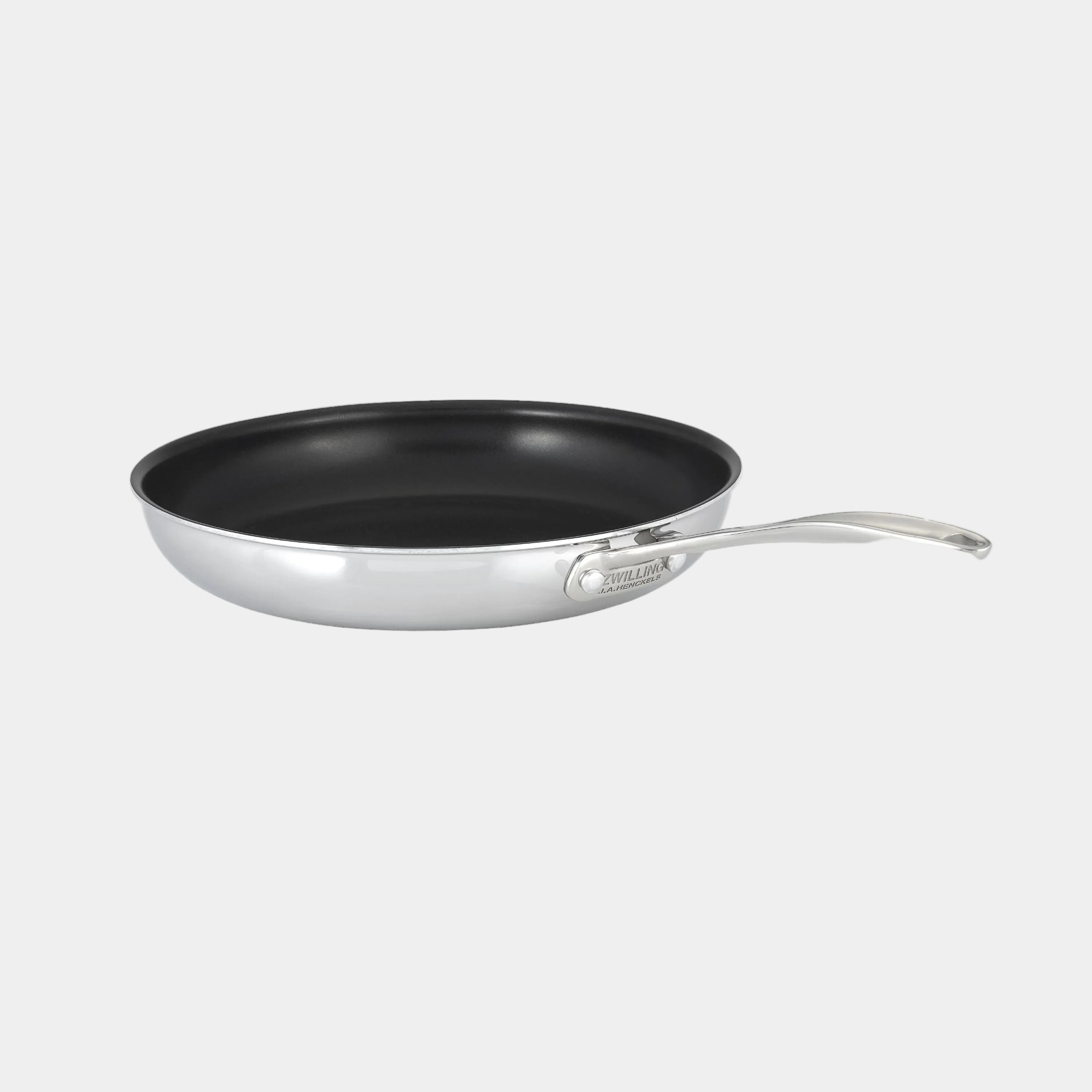 Black frying pan with silver handle on a white background
