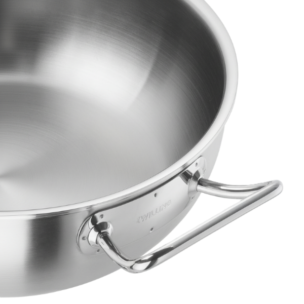 Stainless steel frying pan with handle on a white background