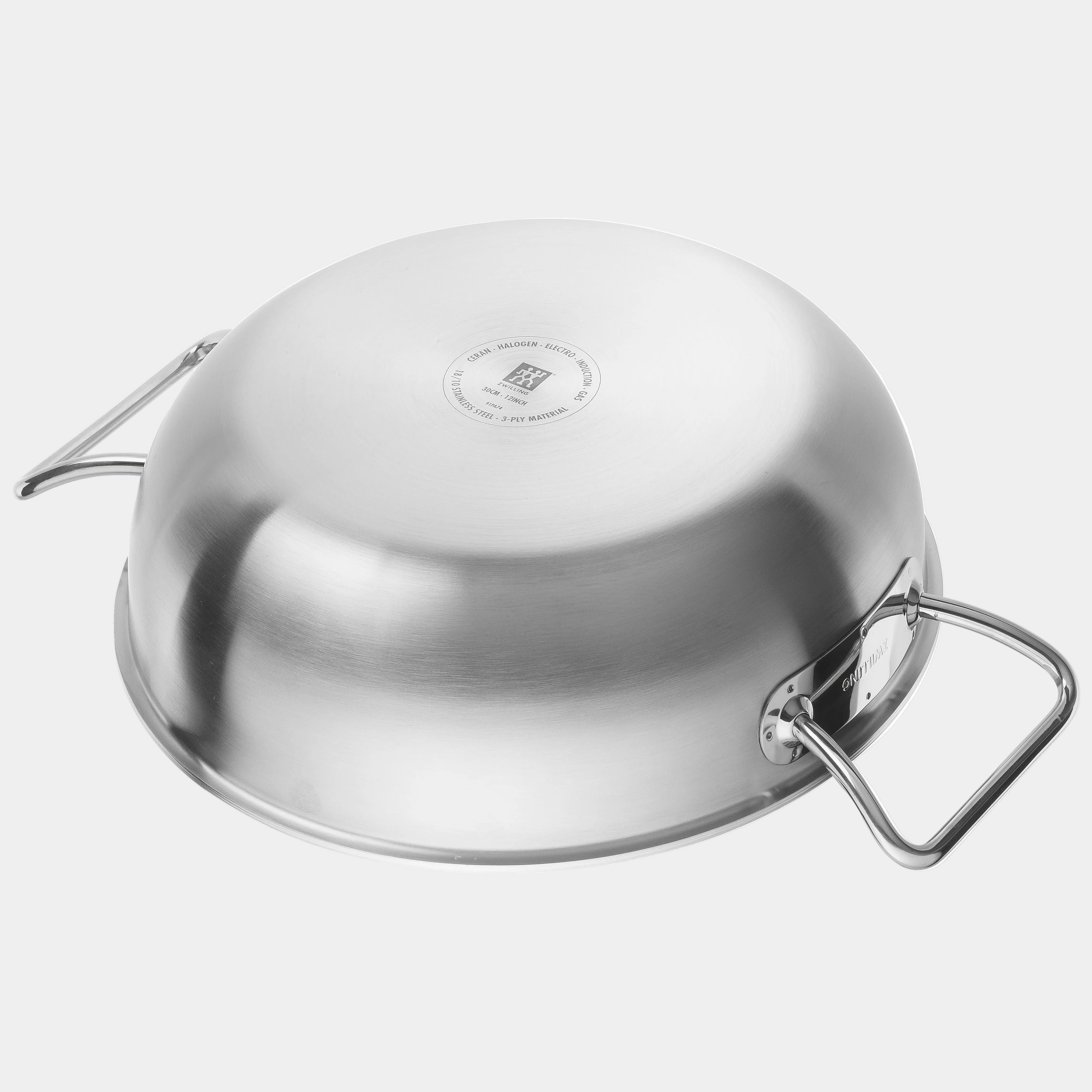 Stainless steel pot with lid on a white background