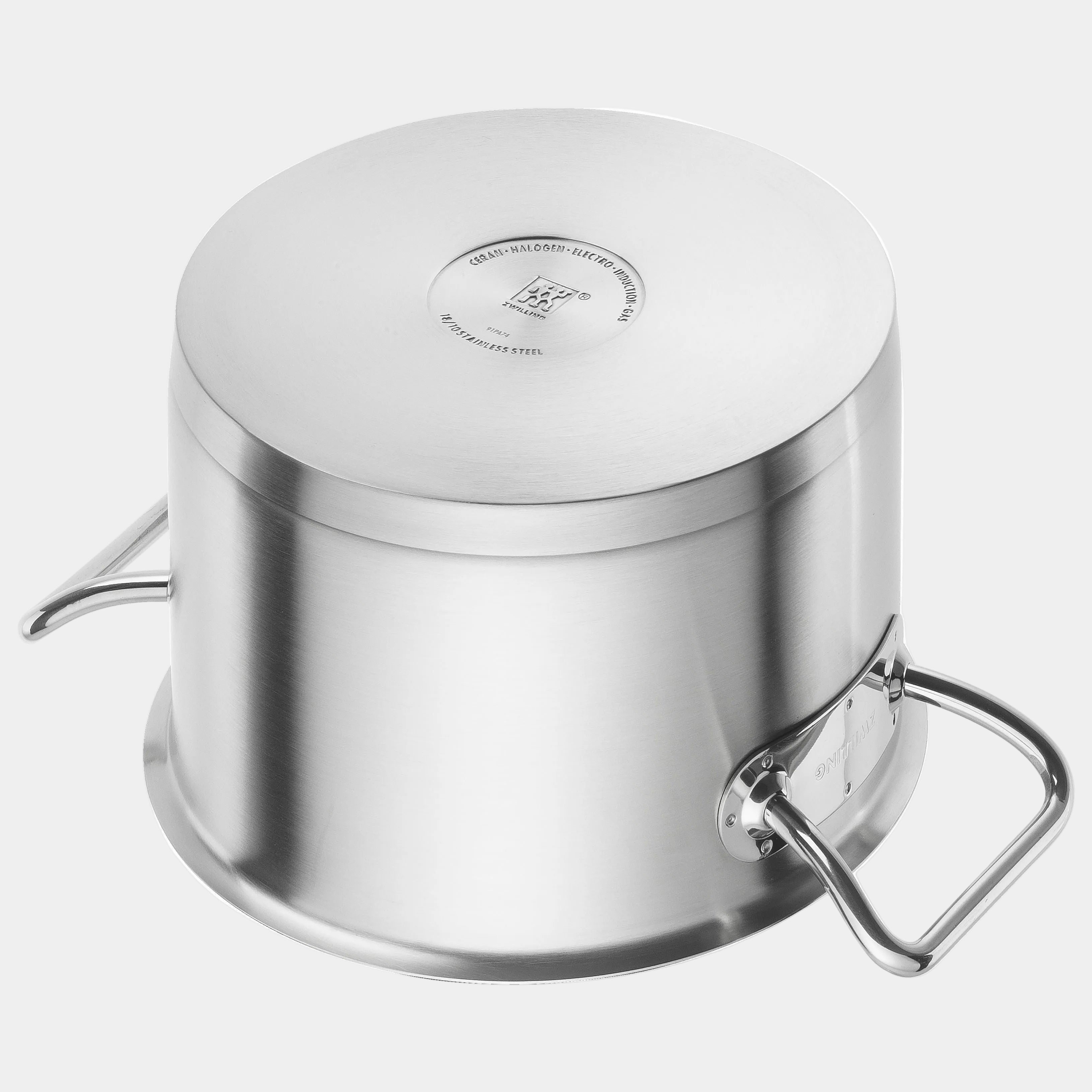 Stainless steel pot with lid on a white background