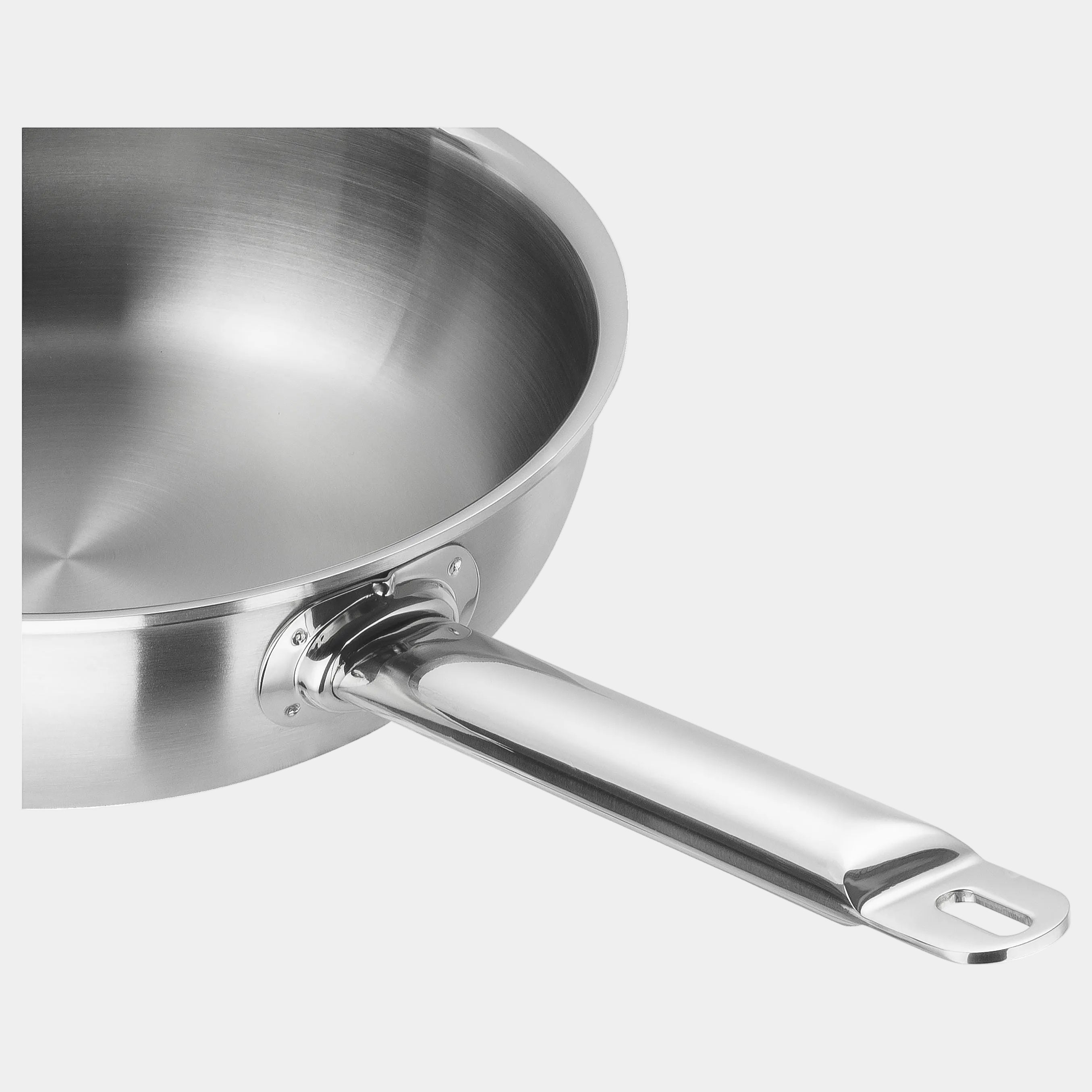 Stainless steel frying pan on a white background