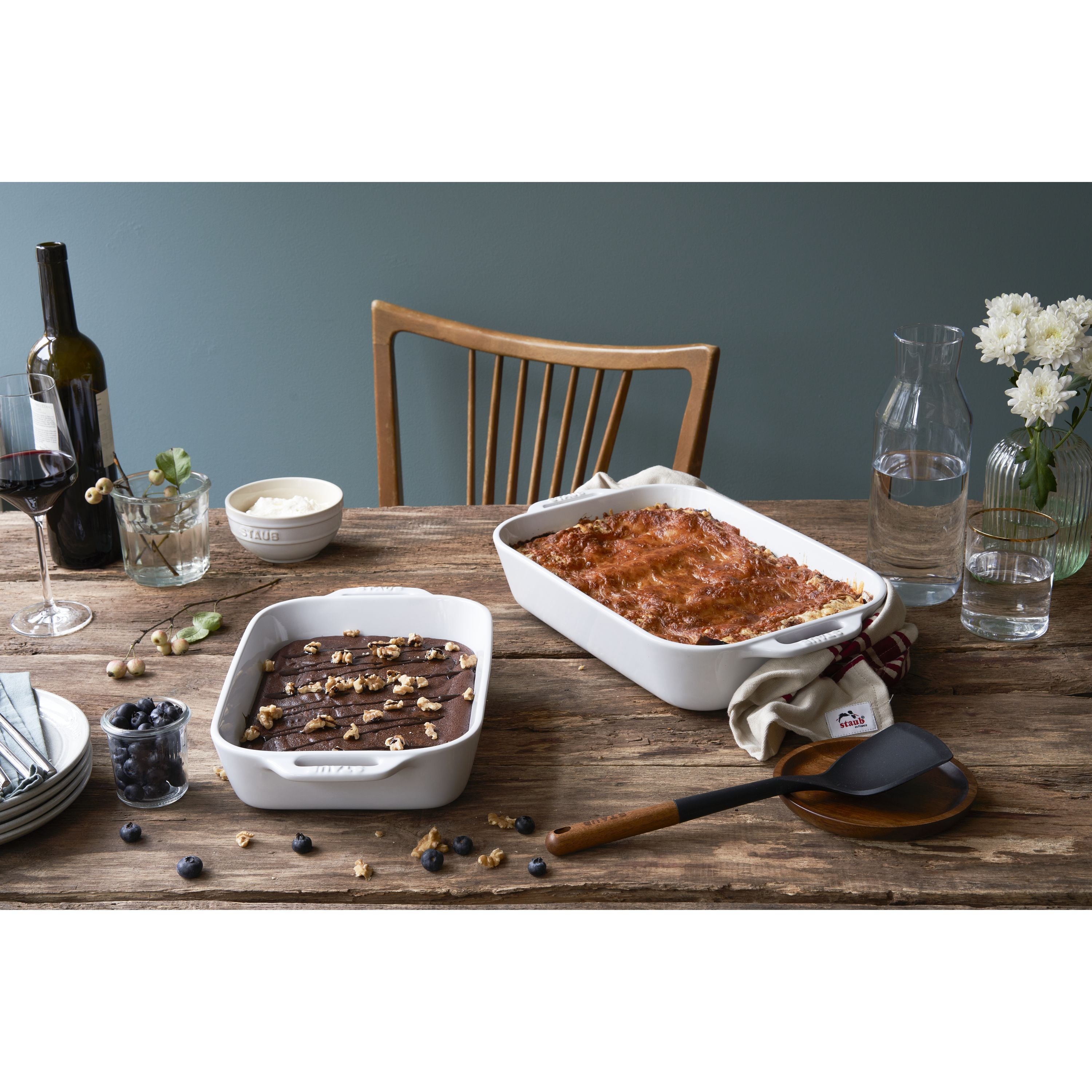 STAUB Ceramique Rectangular Baking Dish Set featuring lasagna and dessert on a rustic wooden table.