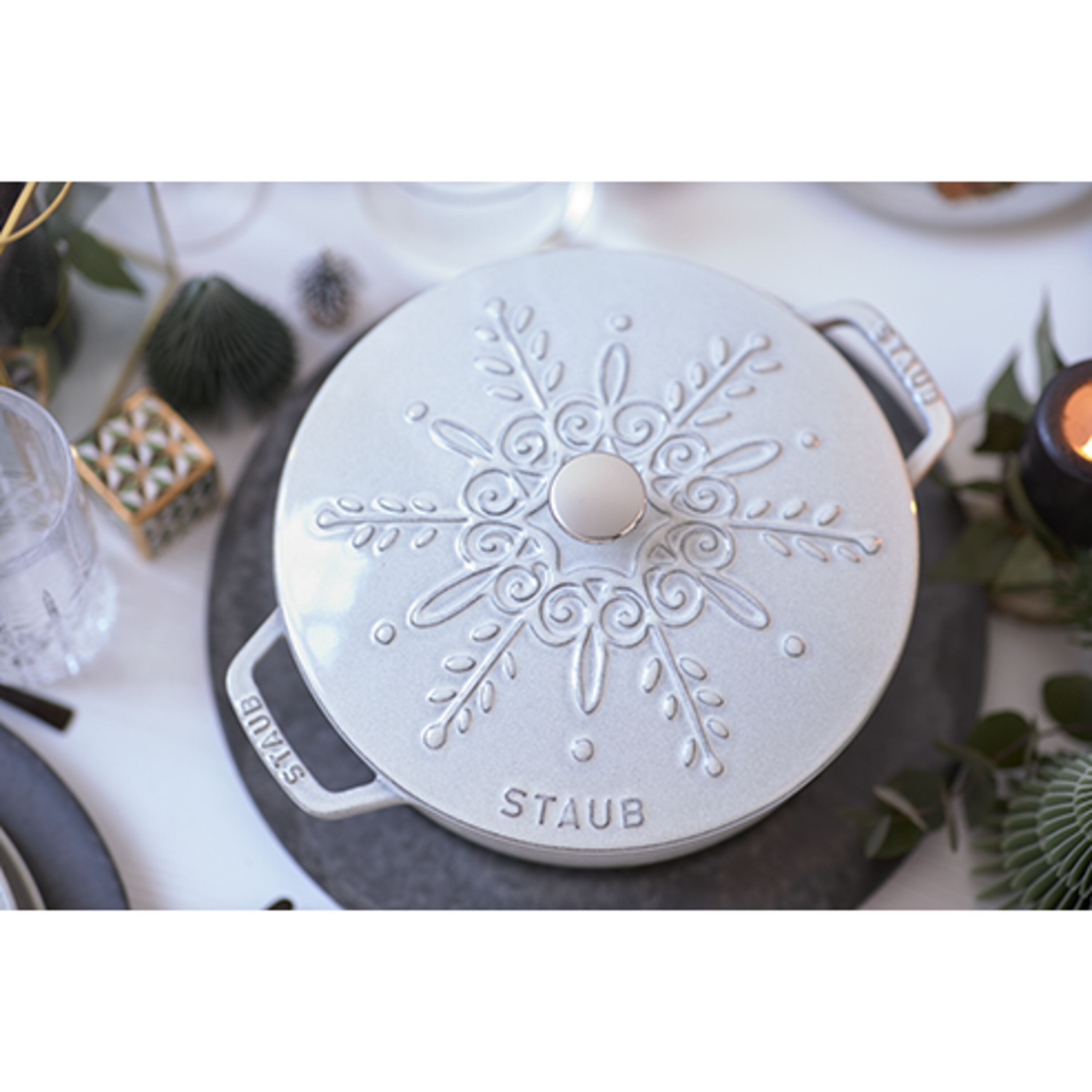 STAUB La Cocotte 3.6L Round French Oven in Snowflake White Truffle design on a table.