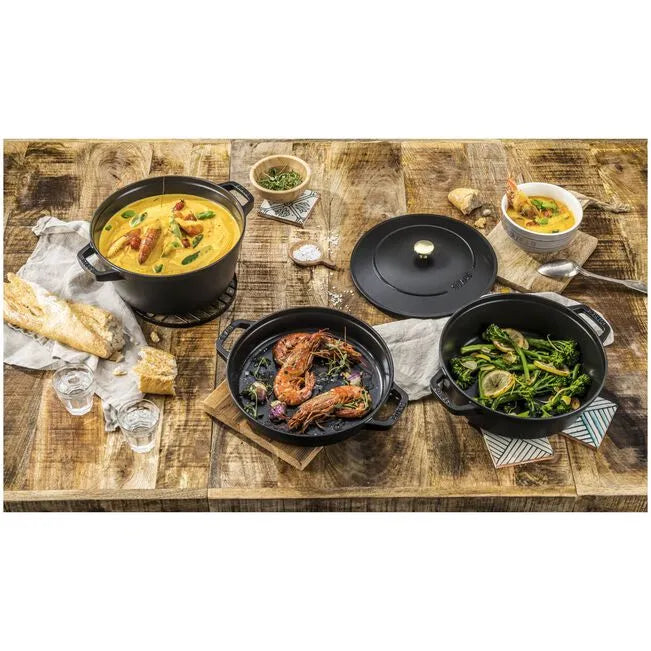 Diverse dishes on a wooden table with cookware