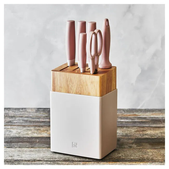 ZWILLING Now S Knife Block Set 7 Piece with pink handles, featuring versatile knives in elegant design, displayed on wooden countertop.