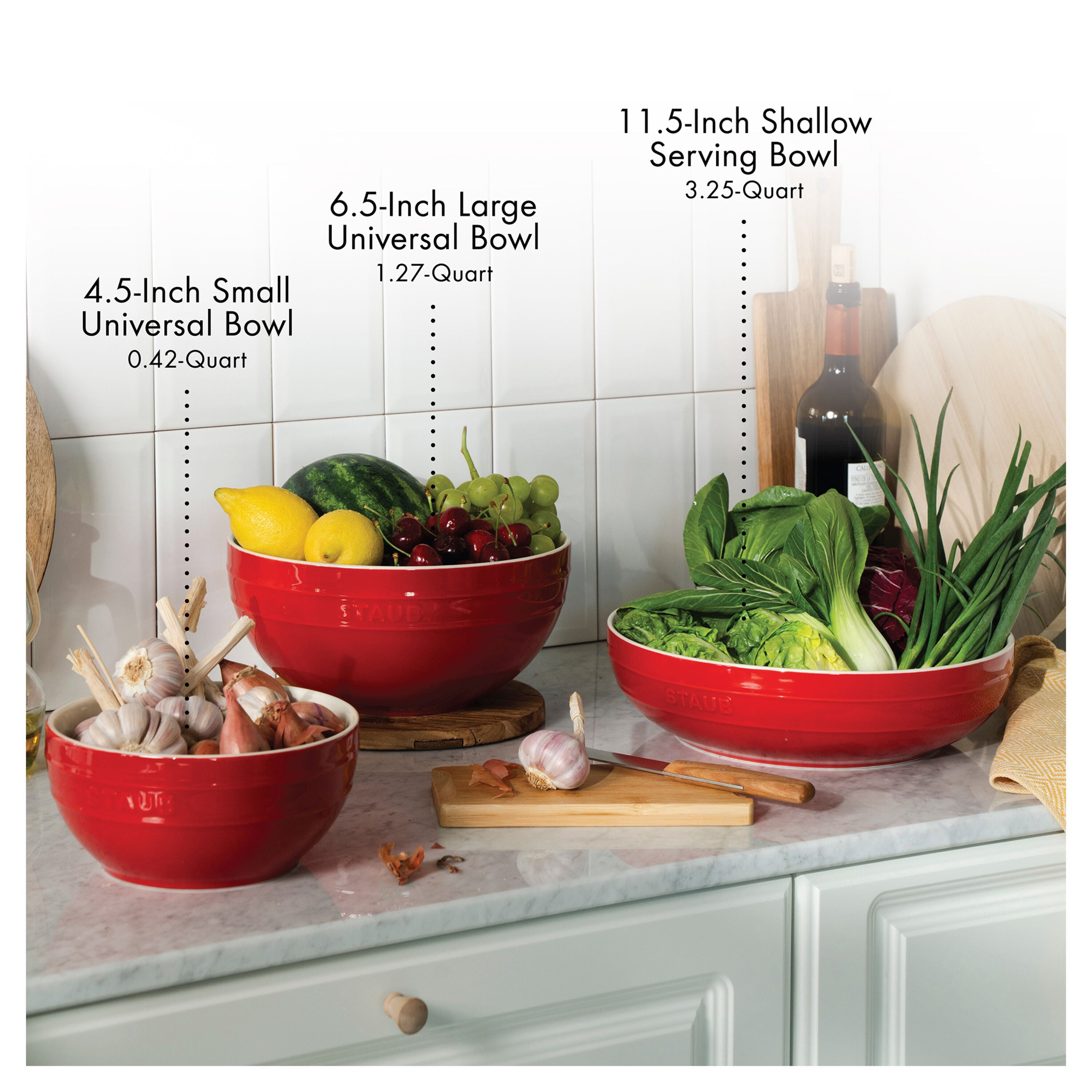 Red bowls of different sizes on a kitchen counter with measurements.
