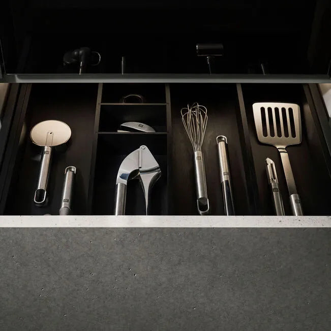 ZWILLING Pro Frying Pan Turner, 35 cm, in a kitchen drawer with other stainless steel utensils.