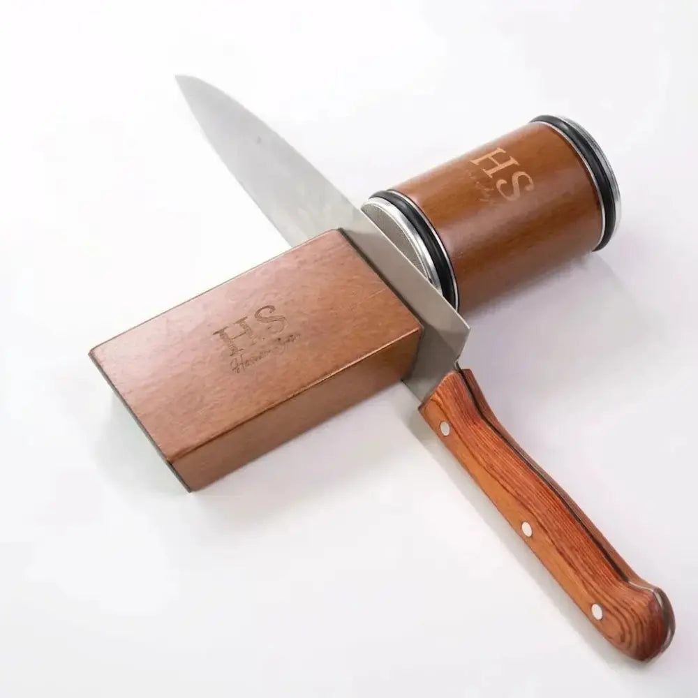 Rolling Knife Sharpener with 15° and 20° guides sharpening a wooden-handled kitchen knife on a white background.