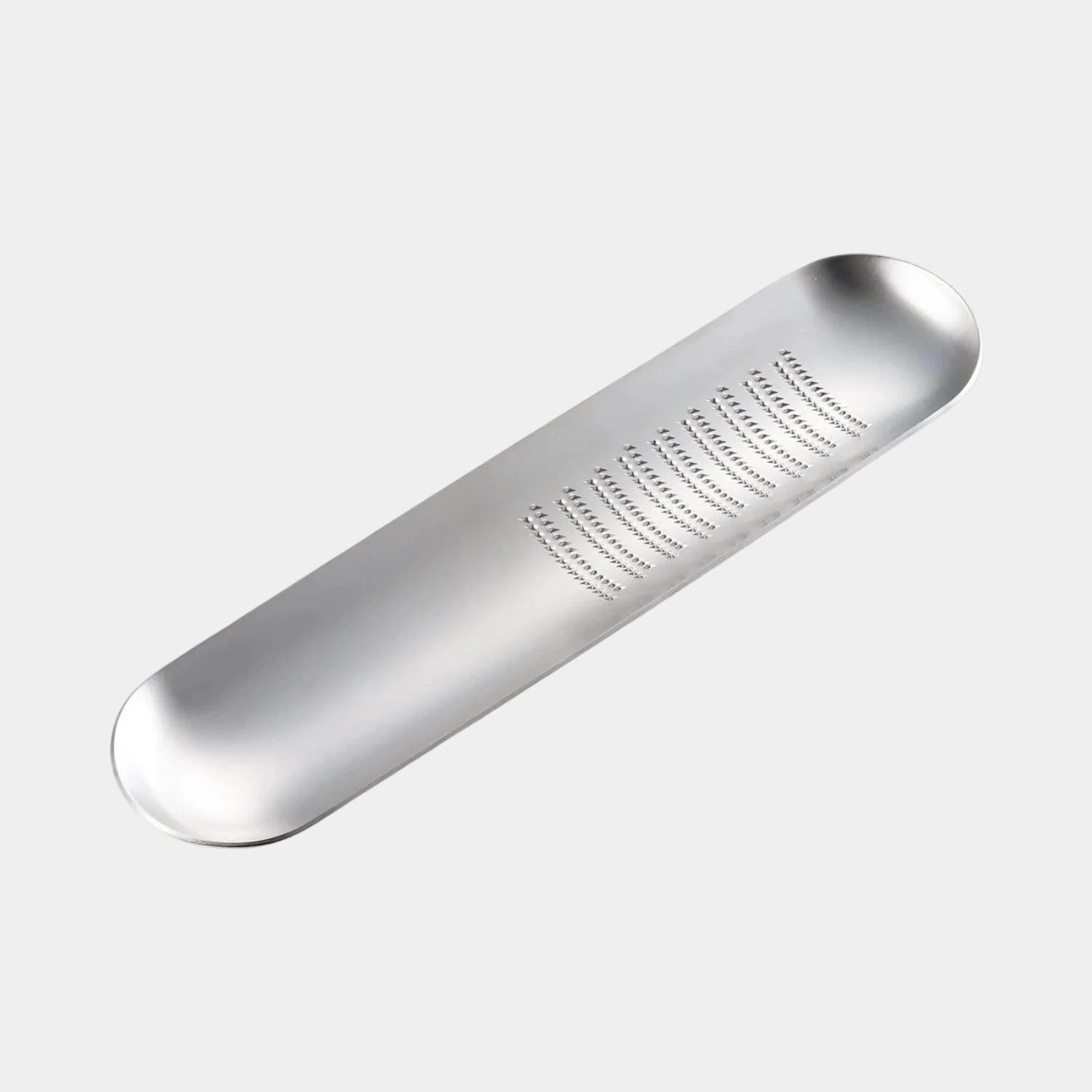 Silver metal tea infuser on a white background