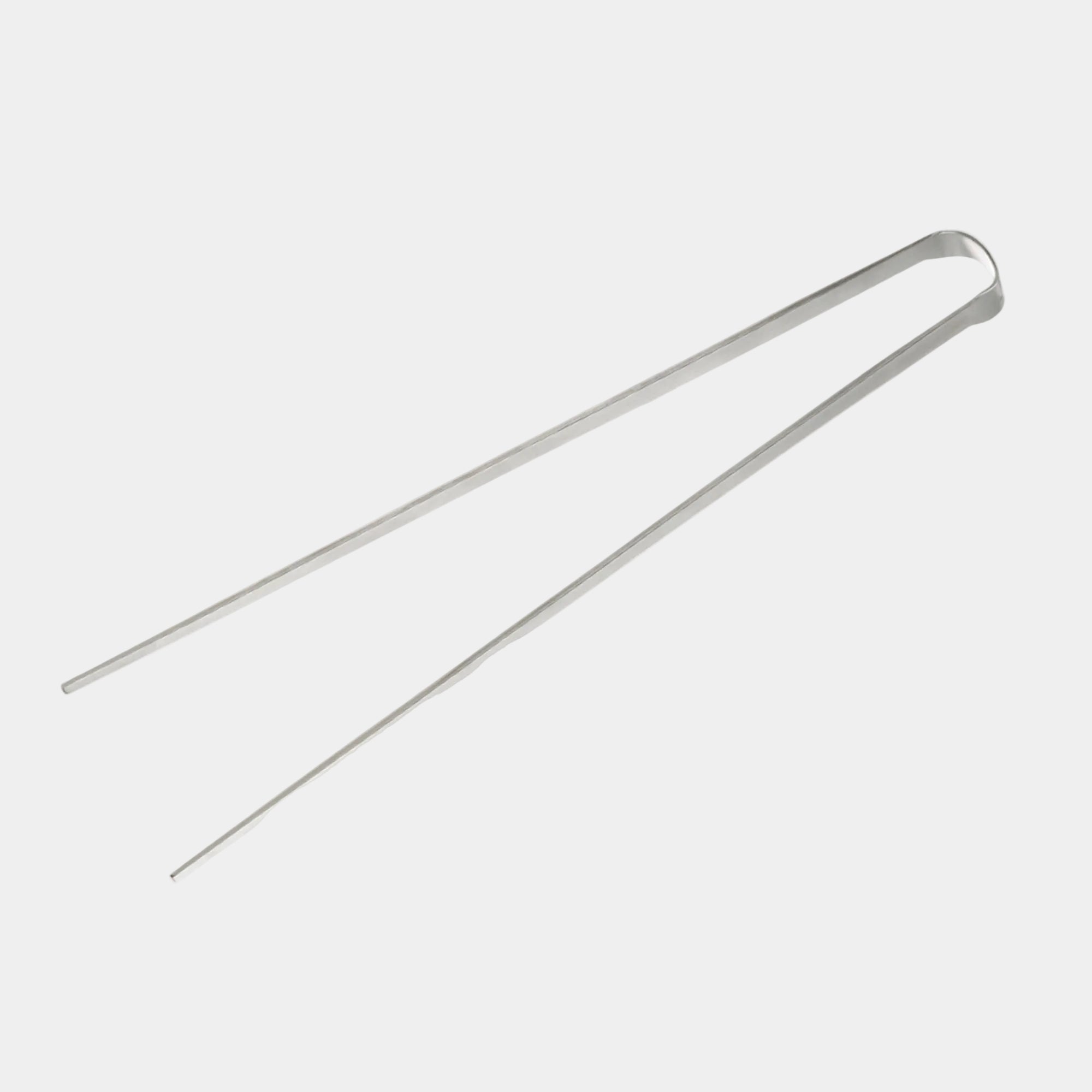 Metal tongs on a white background