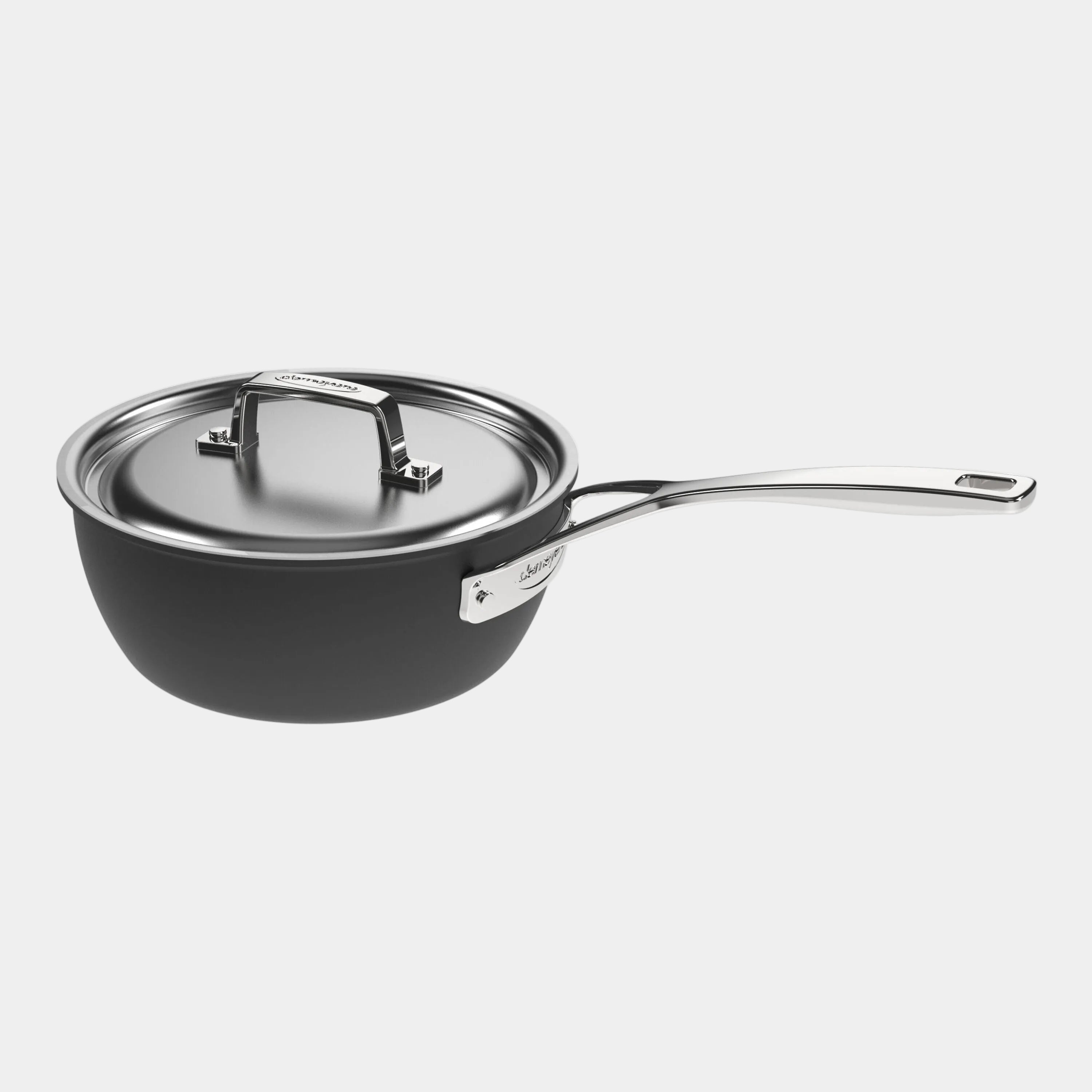 Black saucepan with a lid on a white background