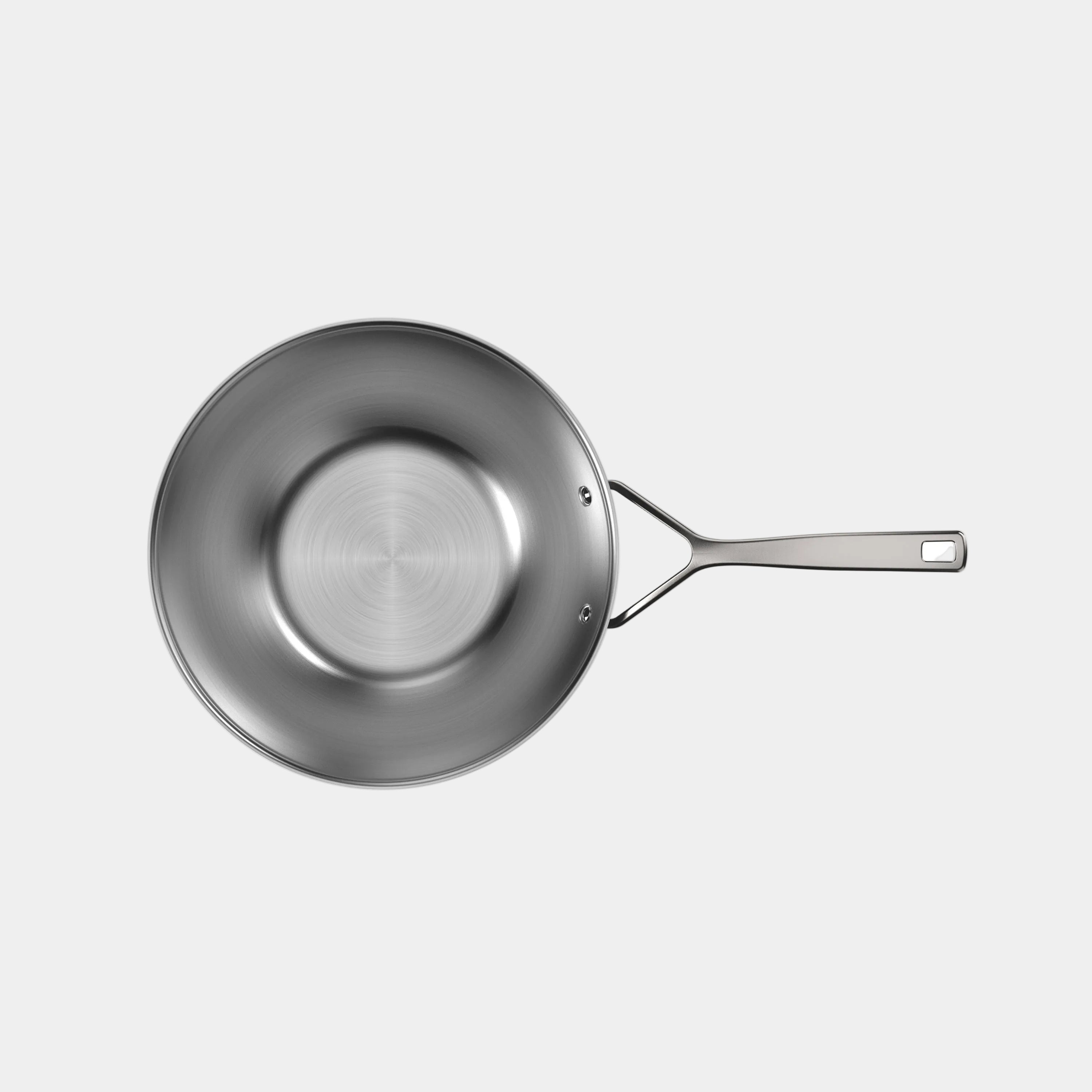 Stainless steel frying pan on a white background
