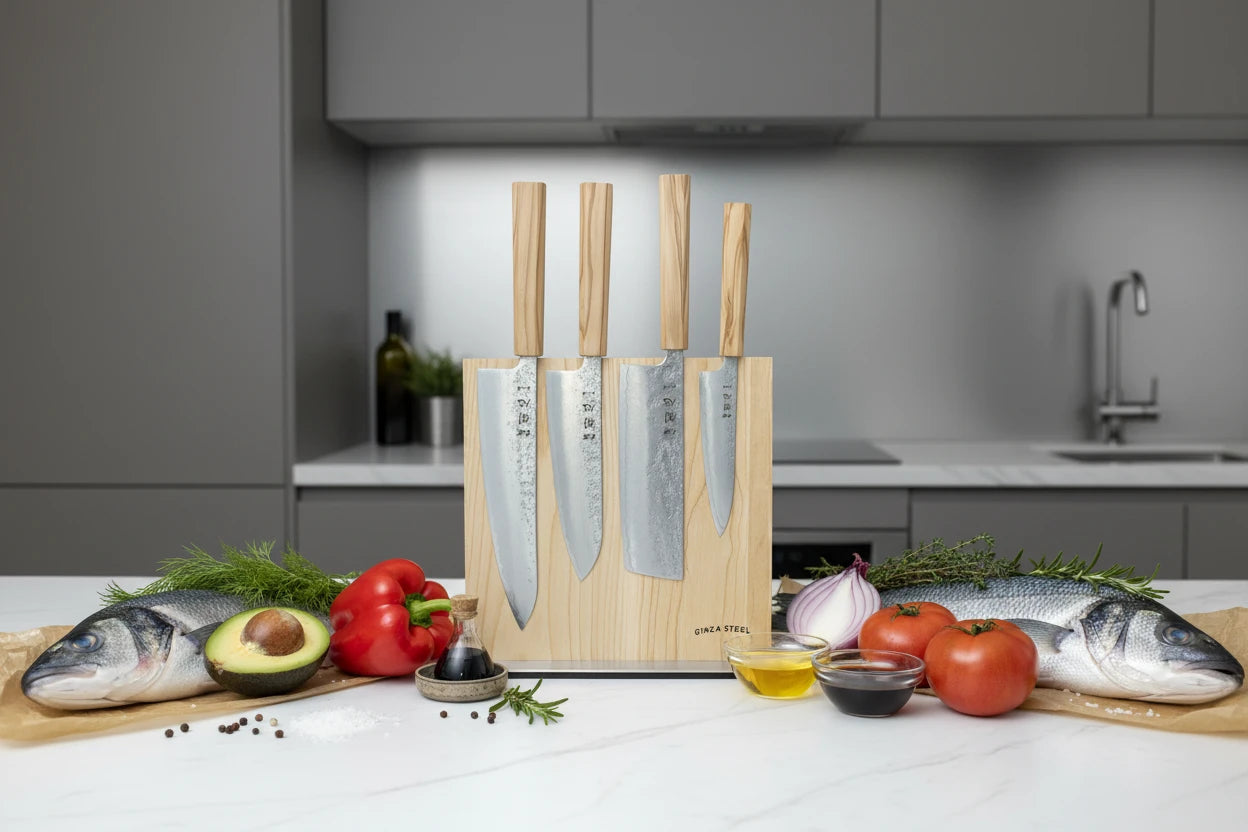Hatsukokoro Ginrei Silver 3 Nashiji 5-piece knife set with magnetic block and olive wood handles in kitchen setting.