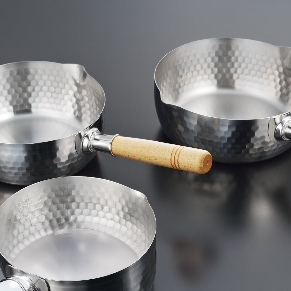 Yoshikawa Yukihira hand-hammered stainless steel saucepan with wooden handle, made in Tsubame-Sanjo, Japan
