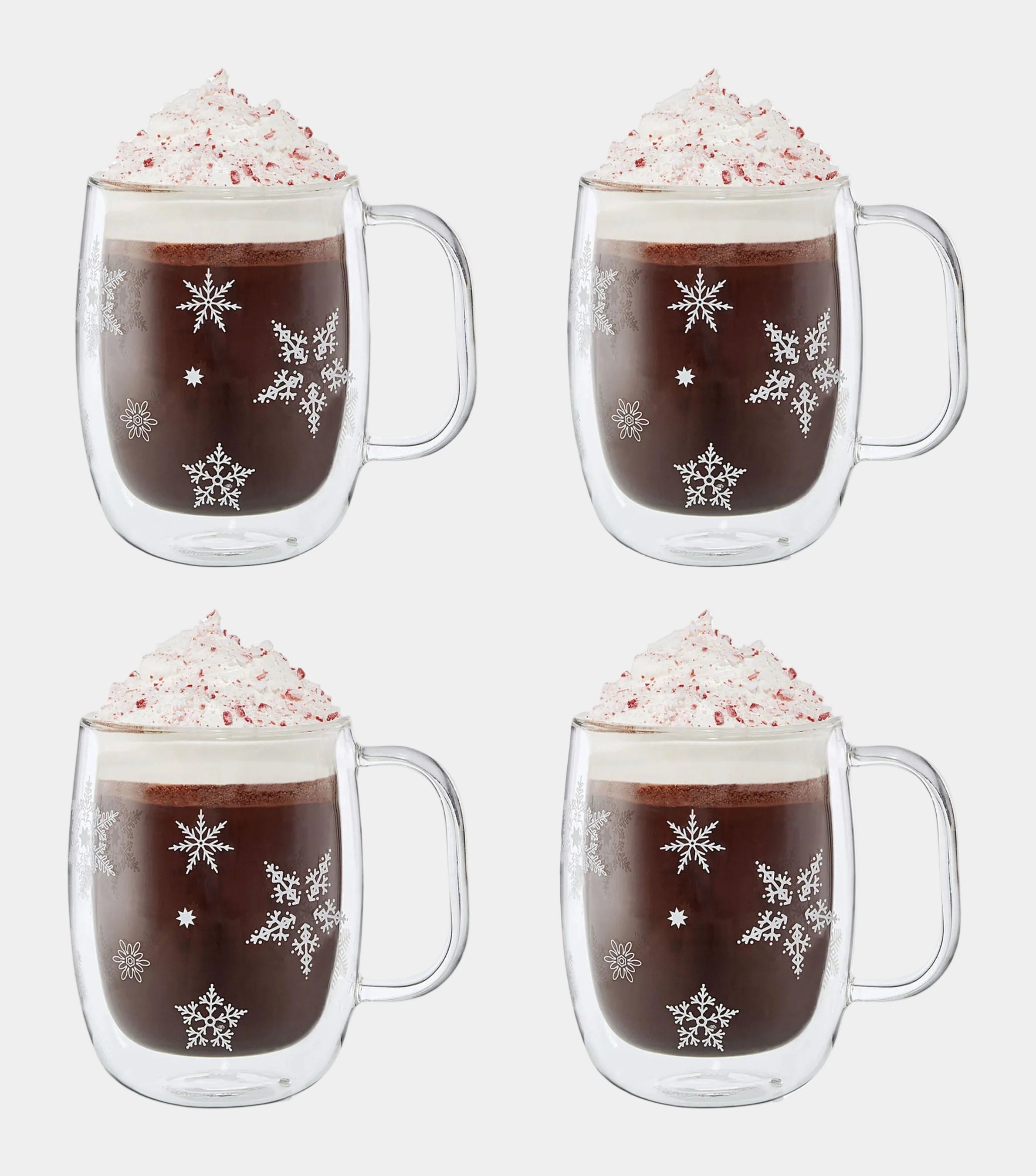 ZWILLING Sorrento Plus Snowflake Double-Walled Mug set of 4 with hot chocolate topped with whipped cream and festive snowflakes.