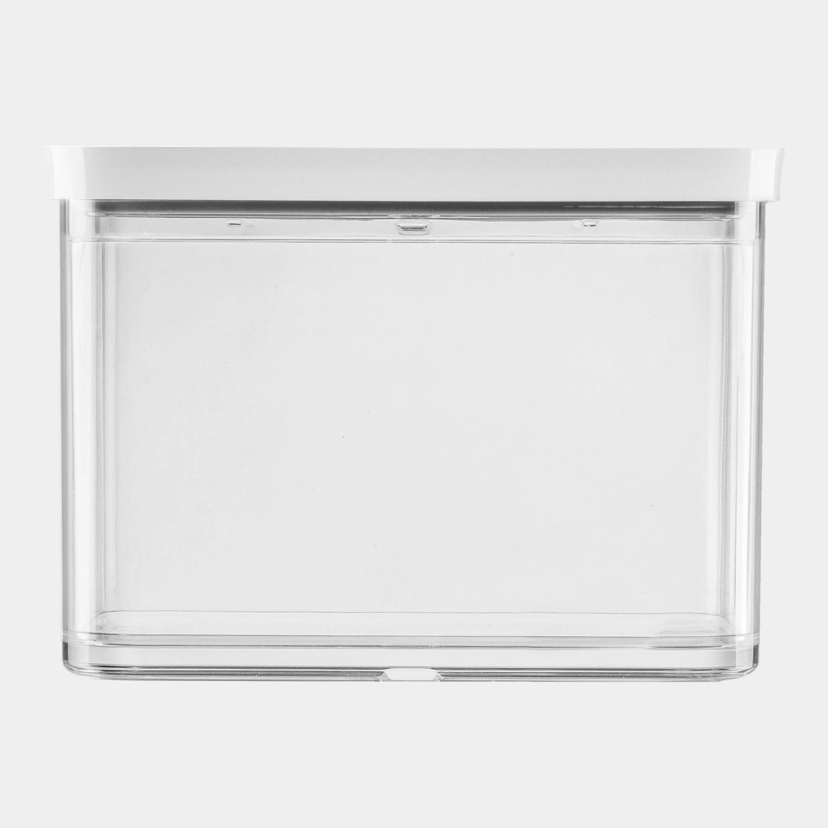 Clear plastic storage container with a white lid on a white background