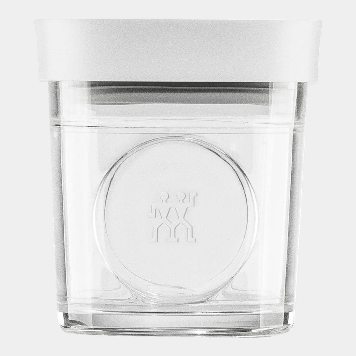 Clear glass container with a white lid on a white background