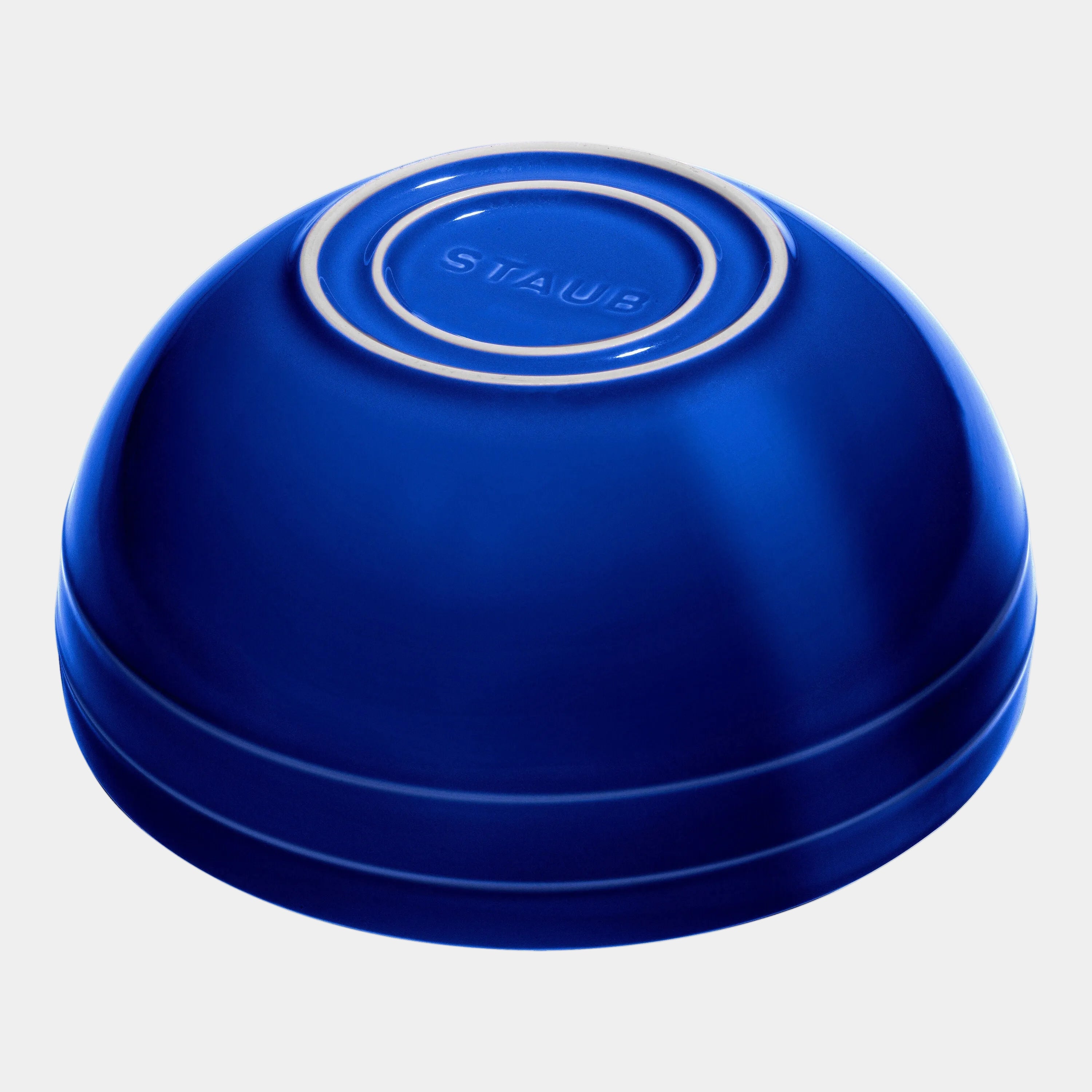 Blue Staub ceramic dish on a white background